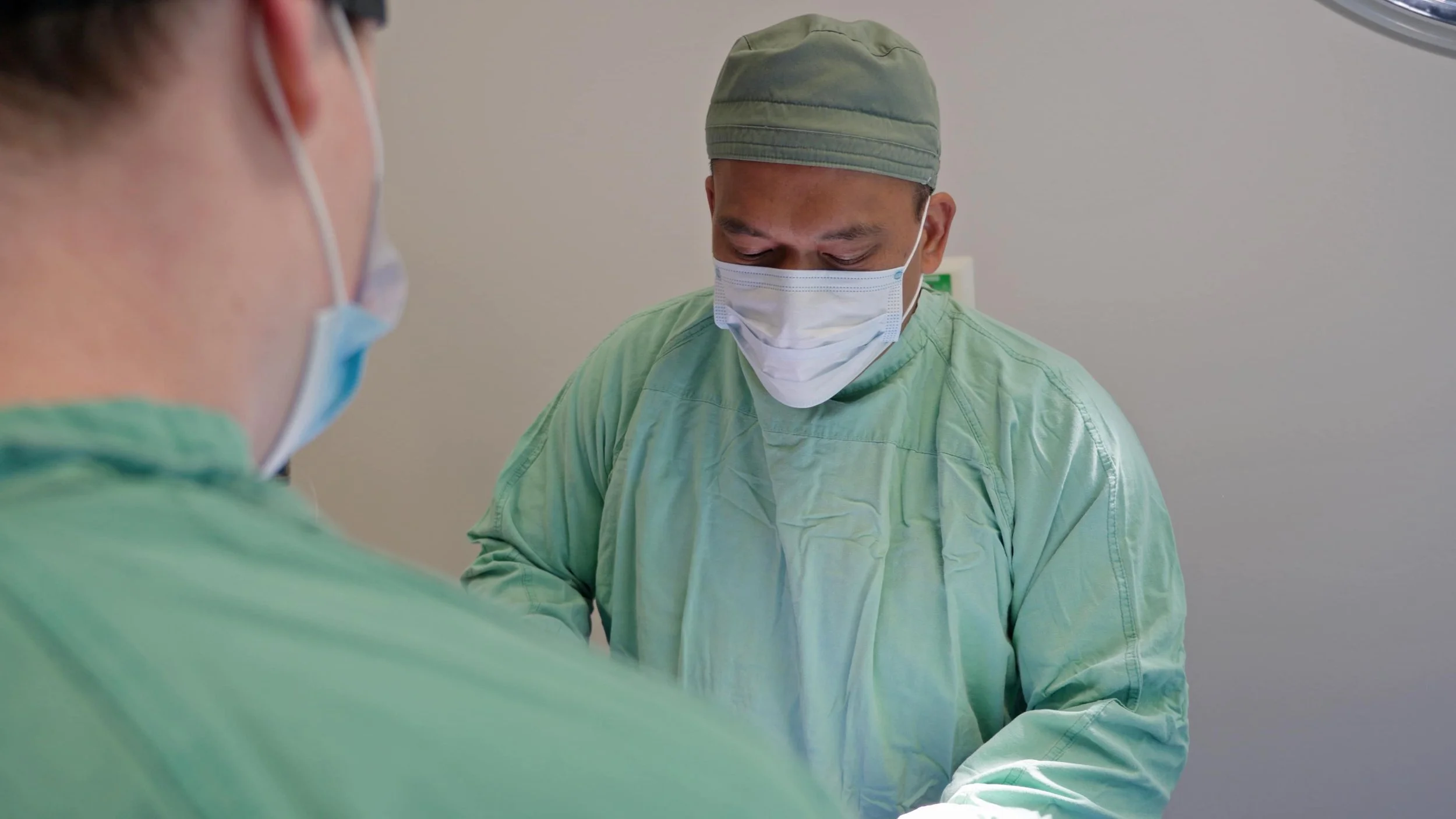 Veterinarian performing a spay procedure, part of Tucker Creek Vet's cat spaying clinic and animal health services.