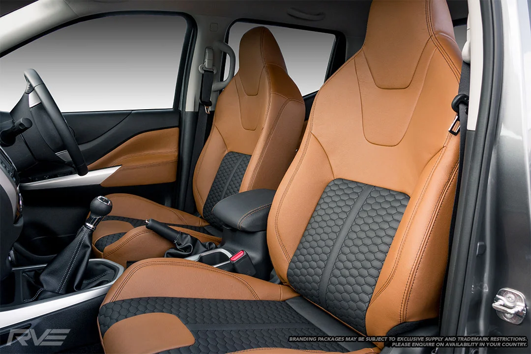 Upgraded tombstone sports seats in saddle brown leather with black honeycomb inserts and black stitching.