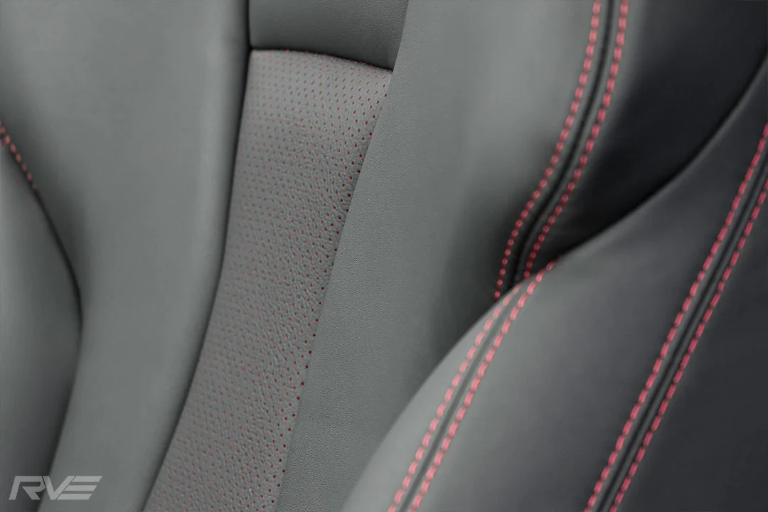 2018 Audi A3 in black leather with red stitching and red-backed perforated inserts.