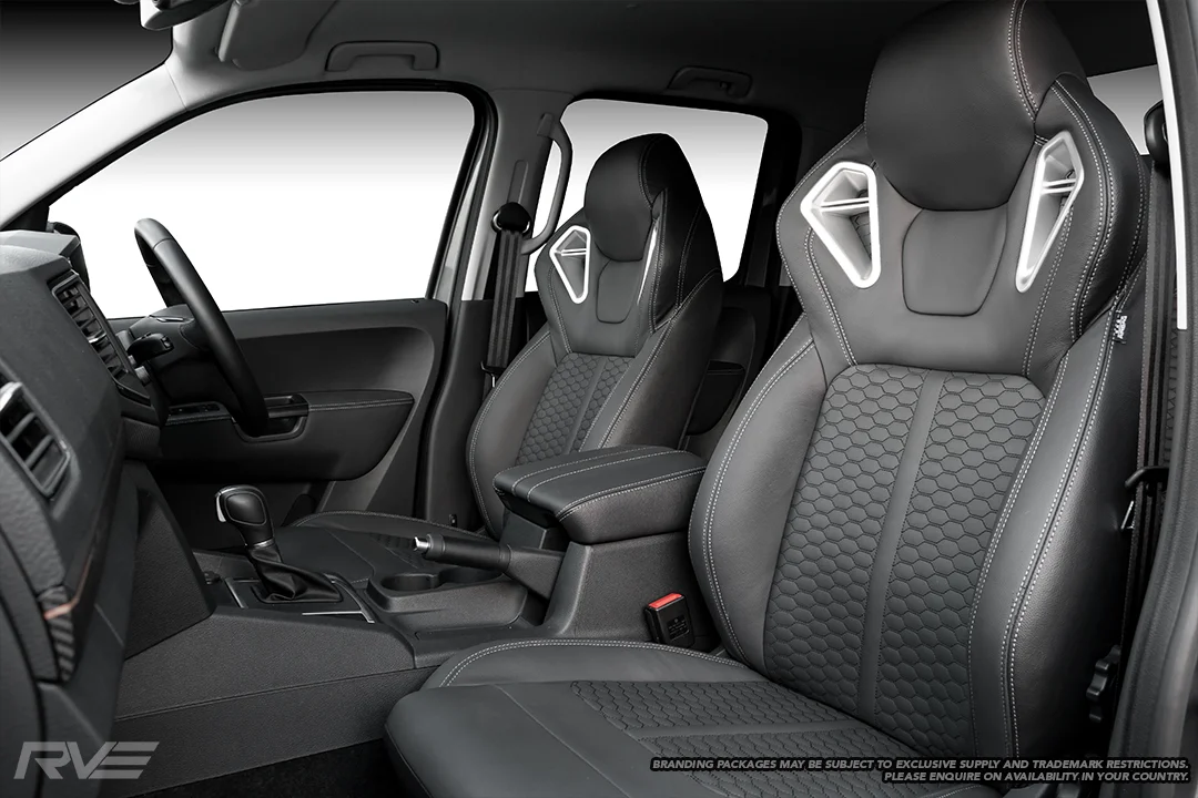 Upgraded Monza sport seats in OEM black leather with silver stitching and black stitched honeycomb inserts.
