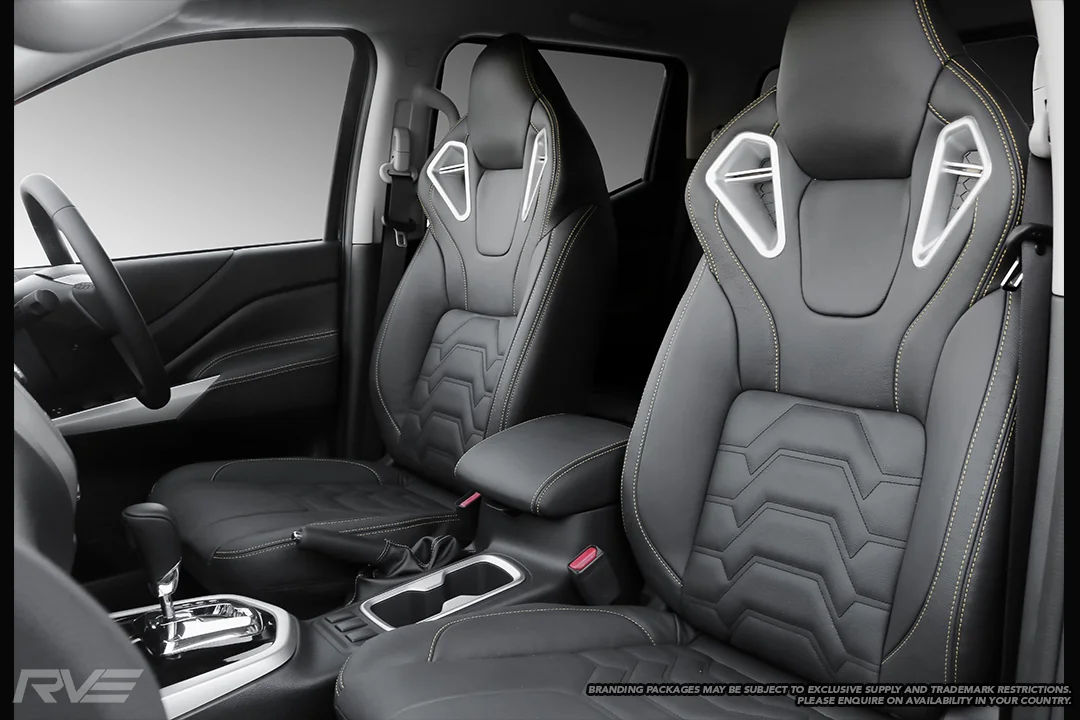 Upgraded Monza sport seats in OEM spec black leather with yellow highlight stitching and armour inserts.