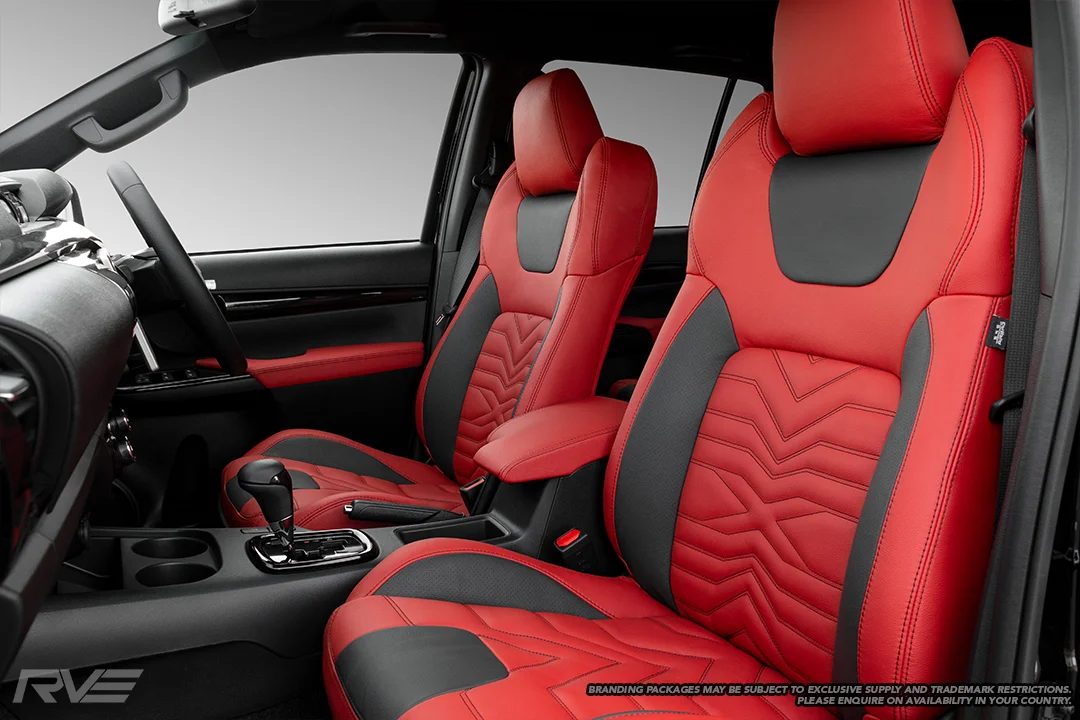Upgraded gull-wing sport seats in red leather with black perforated highlights, ‘X’ inserts and black stitching.