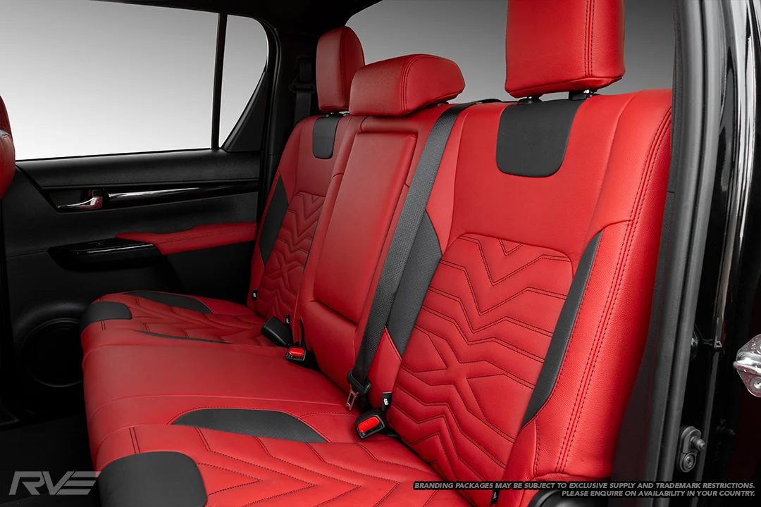 Upgraded gull-wing sport seats in red leather with black perforated highlights, ‘X’ inserts and black stitching.