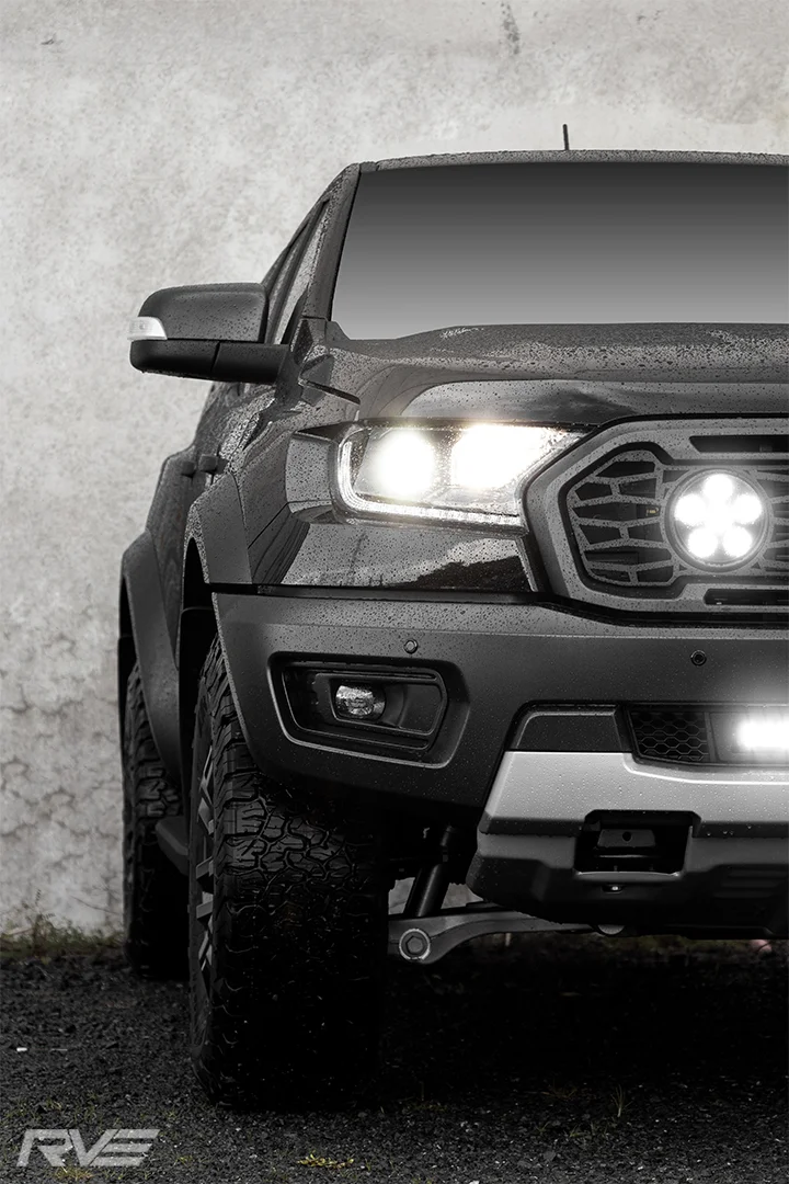 Ford Ranger Raptor with grille mesh and lights and lower grille with light bar.