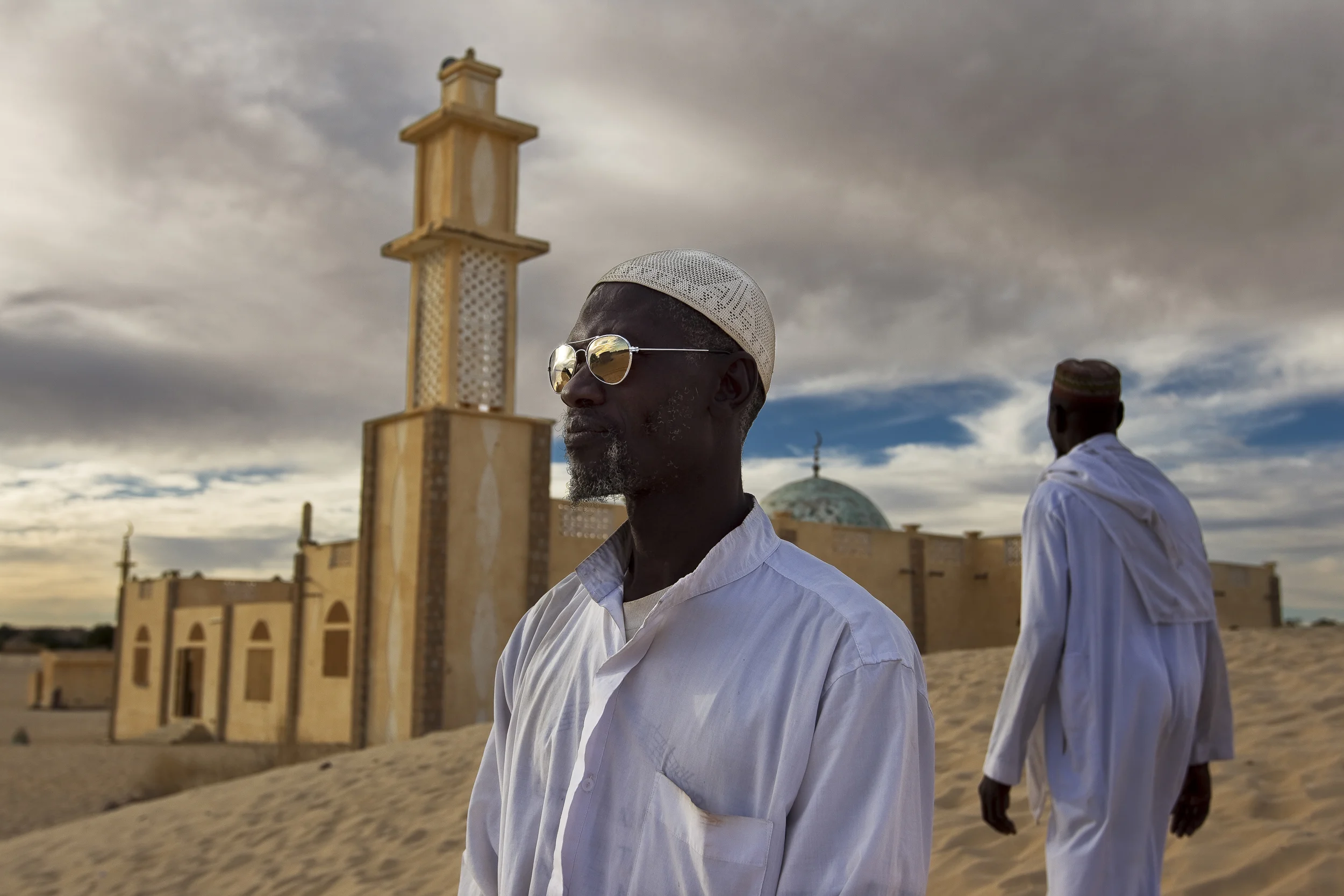 TIMBUKTU, MALI, JANUARY 2010: A Mosque and two muslims on the outskirts of Timbuktu, the mythical Northern Mali city, 23 January 2010. (Photo by Brent Stirton/Reportage by Getty images.)