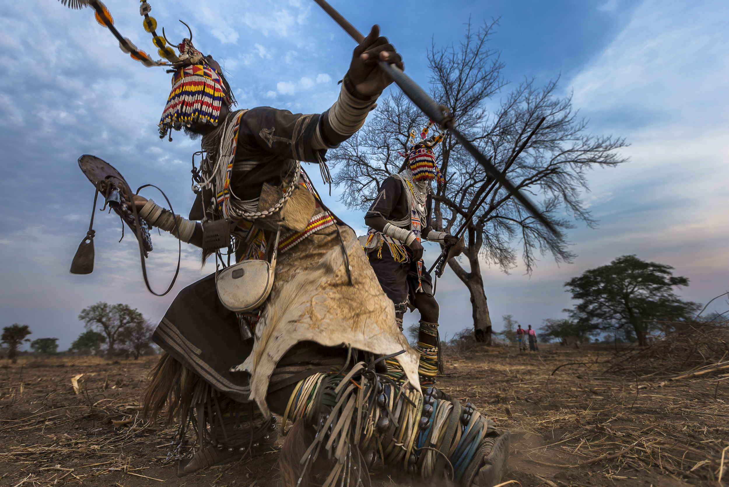 MPIMBWE, WESTERN TANZANIA, OCTOBER 2012: Lion Dancers from the Sakuma tribe perform the story of their lion killing outside a village in rural Mpimbwe, Western Tanzania, October 27, 2012. Lion dancers are men who have killed a lion in defense of the