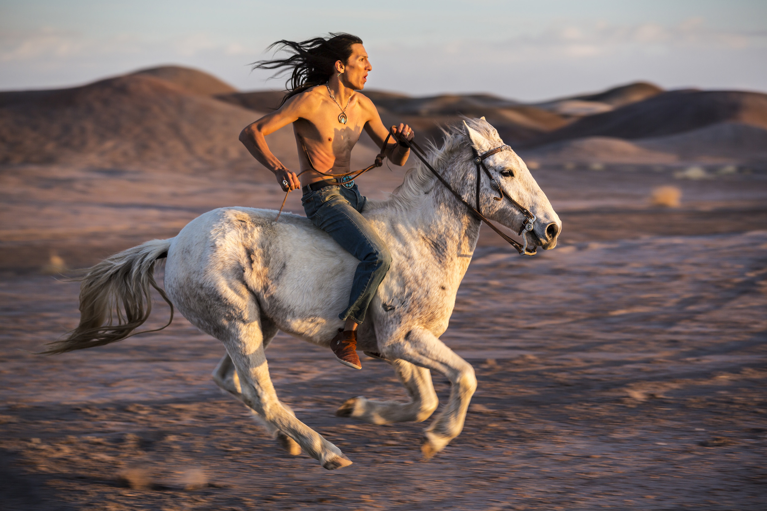 CAMERON, ARIZONA, 16 APRIL 2014: Claysun Benally with his horse in Cameron, Arizona. Claysun is a strong believer in traditional Navajo values and along with his father keeps several horses on their property in Flagstaff. The Navajo have a long rela