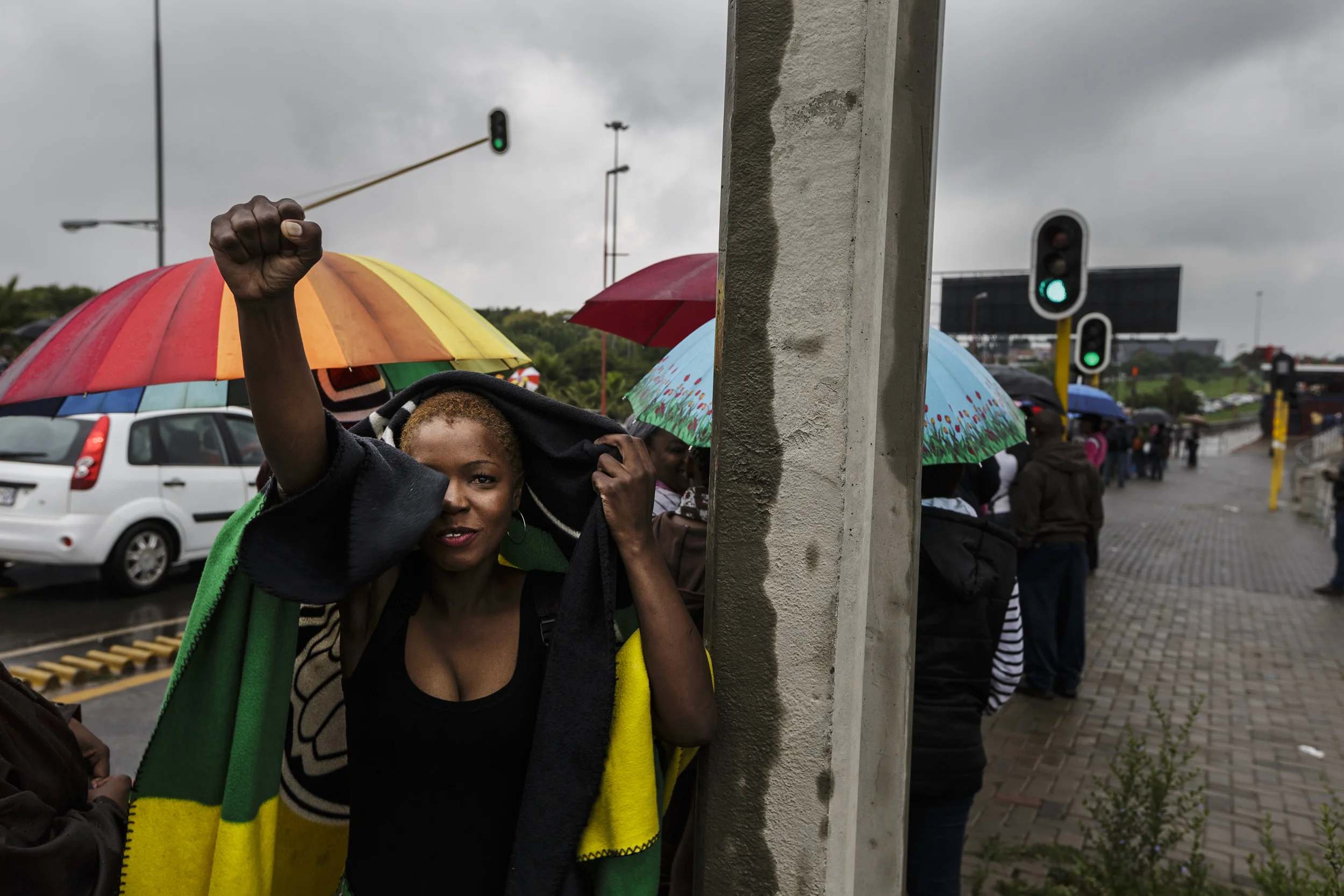 SOWETO, SOUTH AFRICA, 10 DECEMBER 2013: Mandela supporters wait for public transport in the rain on their way to FNB stadium for a day of comemoration for Nelson Mandela, the iconic Freedom Fighter of the ANC, Soweto, South Africa, 10 December 2013. Mandela died on the 5th of December 2013.
(Photo by Brent Stirton/© 2013 Cable News Network. A Time Warner Company. All Rights Reserved.)