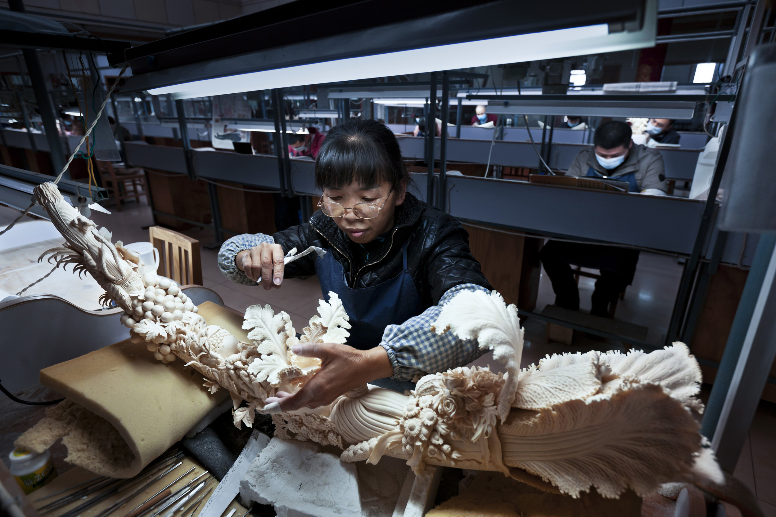 BEIJING, CHINA, NOVEMBER 2011: Scenes from China National Arts and Crafts Corporation - Ivory Carving factory, Beijing, China, November 17. Started in 2009 after China's big African Ivory purchase, this is supposedly the world's largest Ivory carvin