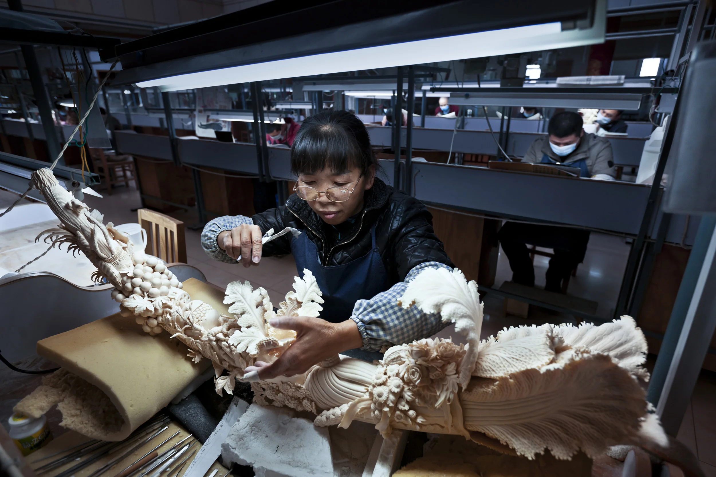 BEIJING, CHINA, NOVEMBER 2011: Scenes from China National Arts and Crafts Corporation - Ivory Carving factory, Beijing, China, November 17. Started in 2009 after China's big African Ivory purchase, this is supposedly the world's largest Ivory carving facility, employing more than 20 carvers and carving an alleged 750 kg of raw ivory annually. The director of the factory stated that the factory was started as a State initiative against the demise of the Ivory carving industry. State owned, it is a clear indication of the Chinese government's investment into the future of the Ivory carving trade. This factory also carves a ton of Mammoth Ivory every year. (Photo by Brent Stirton/Reportage for National Geographic Magazine.)