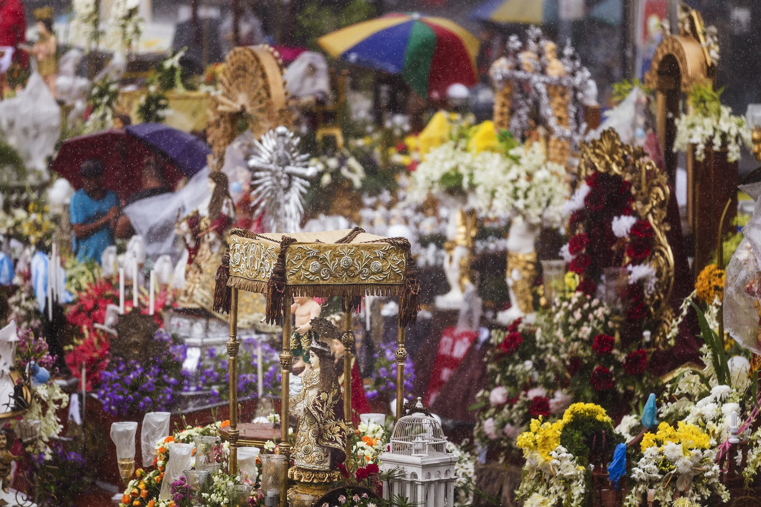 MALOLOS, PHILIPPINES, JANUARY 2012: Over 200 hundred Santo Nino Coronas housing Santo Nino icons wait in Malolos Basilica for a religious procession in the streets of Malolos, the birthplace of the Santo Nino phenomenon in the Philippines, January 28 2012. Many of these icons have heads and hands made of solid Ivory, many of these pieces are made recently, in the post Ivory ban period. It is very difficult to tell whether this work is made from illegal ivory, of which there is a great deal in the Philippines, mostly used for the carving of religious iconography. What is for certain is that there is a thriving trade in the ivory carving for religious icon purposes. The Philippines has no elephant population but is one of the largest users of Ivory. (Photo by Brent Stirton/Reportage by National Geographic.)