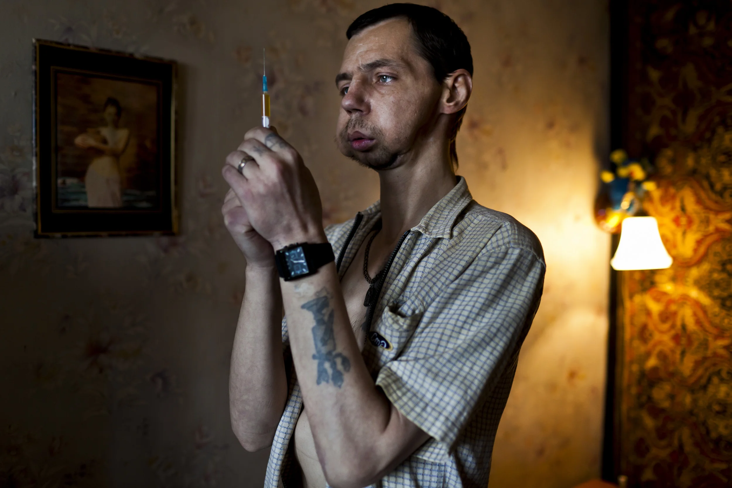 KHARKOV, UKRAINE, AUGUST 2011: Addicts cook up an Ephedrine based Amphetamine cocktail in a small apartment in a housing project in Kharkov, Ukraine, 28 August 2011. (Photo by Brent Stirton/Reportage for Getty Images.)