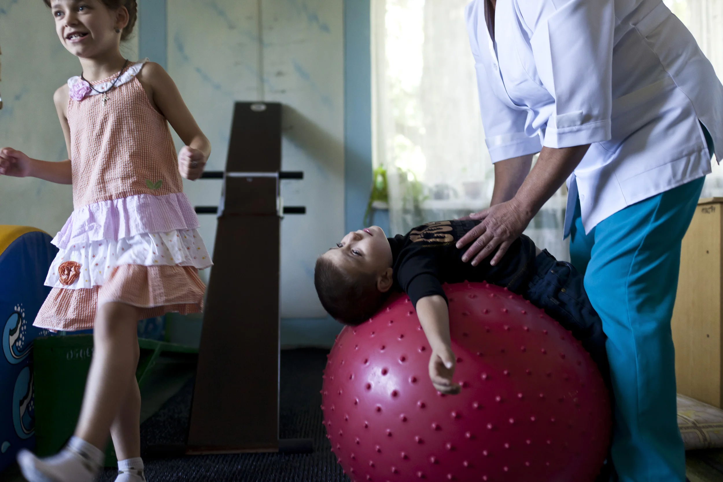 KHARKOV, UKRAINE, AUGUST 2011: In addition to normally orphaned children, Orphanage Zeleniy Gai in Kharkov, Ukraine is a home to HIV + children, Aids affected children as well as children removed from homes where parents were either too addicted to care for them or too remiss as a result of their addictions, August 28 2011. This orphanage is one of the few in Ukraine to make children living with HIV a priority. There are special excercise programs, therapy using animals and special new born units all designed to care for these children. (Photo by Brent Stirton/Reportage for Getty Images.)