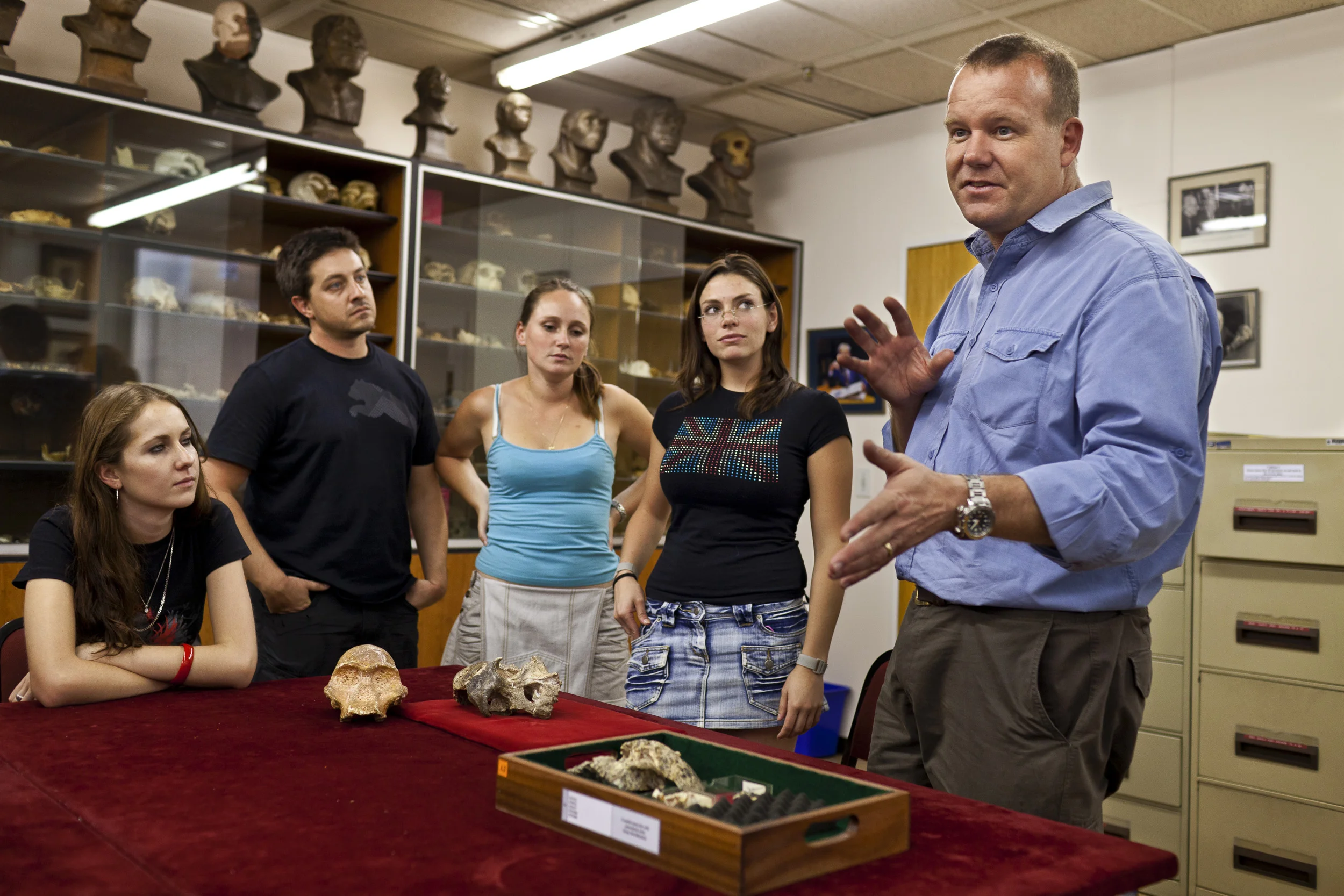 JOHANNESBURG, SOUTH AFRICA, OCTOBER 2010: Professor Lee Berger teaches an early man fossil class to students inside the fossil vault at the Wits University Medical department, Johannesburg, South Africa, 12 October, 2010. Professor Berger has been responsible for a number of important Hominid fossil discoveries, the most recent of which is the Sediba fossil, this find represents a new Hominid genus, something not seen before in the evolution of early man. These fossil finds at Malapa in the Cradle of Humankind area of South Africa are unprecented in their completeness and sheer number. There are so far an adult female and juvenile male who are almost intact as well as evidence of at least 4 other skeletons. There has never been a find of similar scale in the homind section of the Paleotological world. Over 76 scientists around the world are currently working together on this project. (Photo by Brent Stirton/Reportage for National Geographic.)