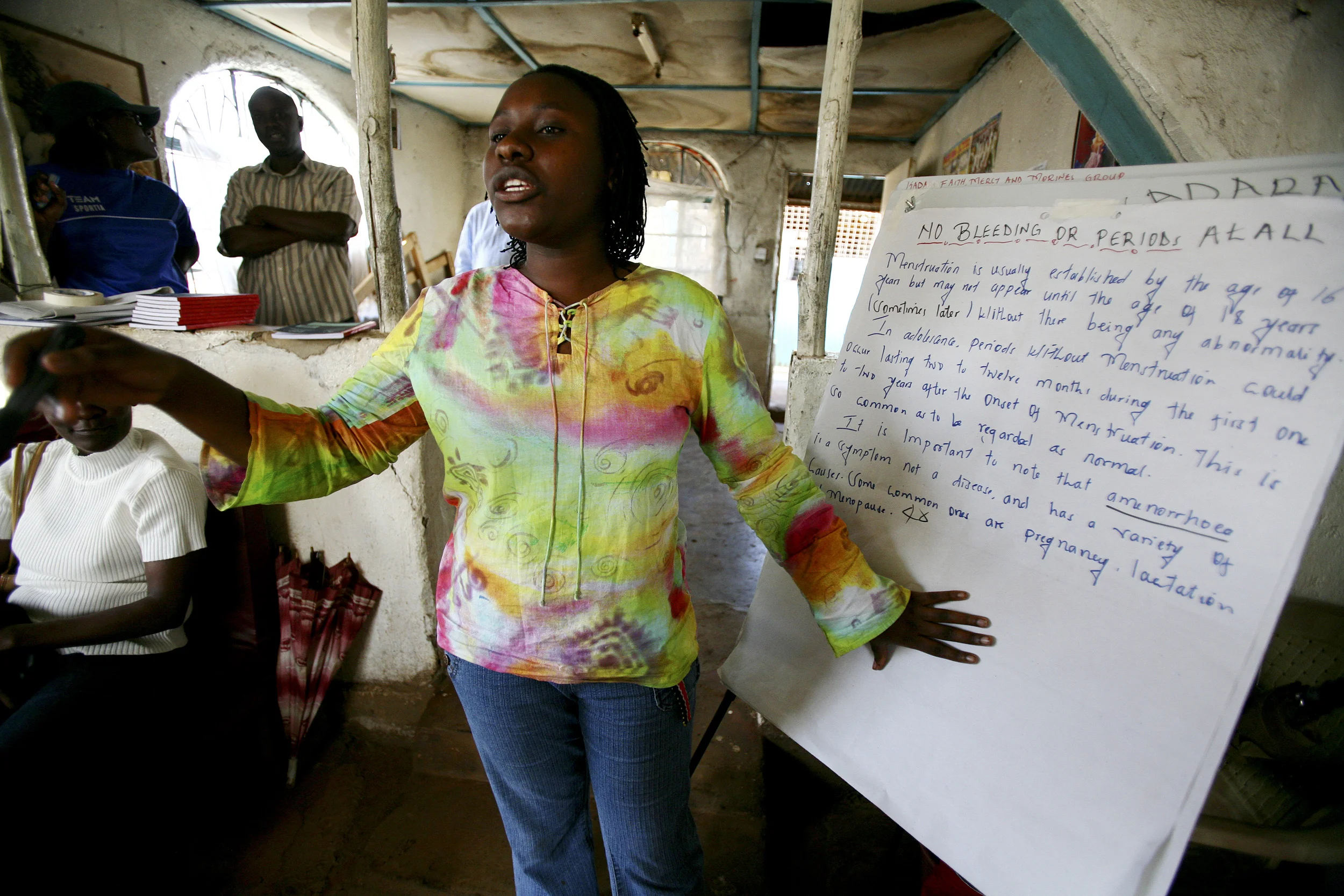 Kibera Slum, Nairobi Kenya - December 2006: Rights workshops and self-empowerment classes for young women and girls in the sprawling Kibera slum in Nairobi. These young women have very little protection and even less awareness of their rights as women. These classes are women teaching women about their bodies, their right to say no, how to avoid dangerous situations, aids and safe sex education and financial empowerment through savings workshops. HIV rates in Kenya are now at 5 to 1 in terms of women to men, indicating a strong feminisation of the disease. As a result groups of Kenyan HIV+ women are banding together to offer each other education and support. photo by Brent Stirton/Getty Images for the Global Business Coalition against Aids.