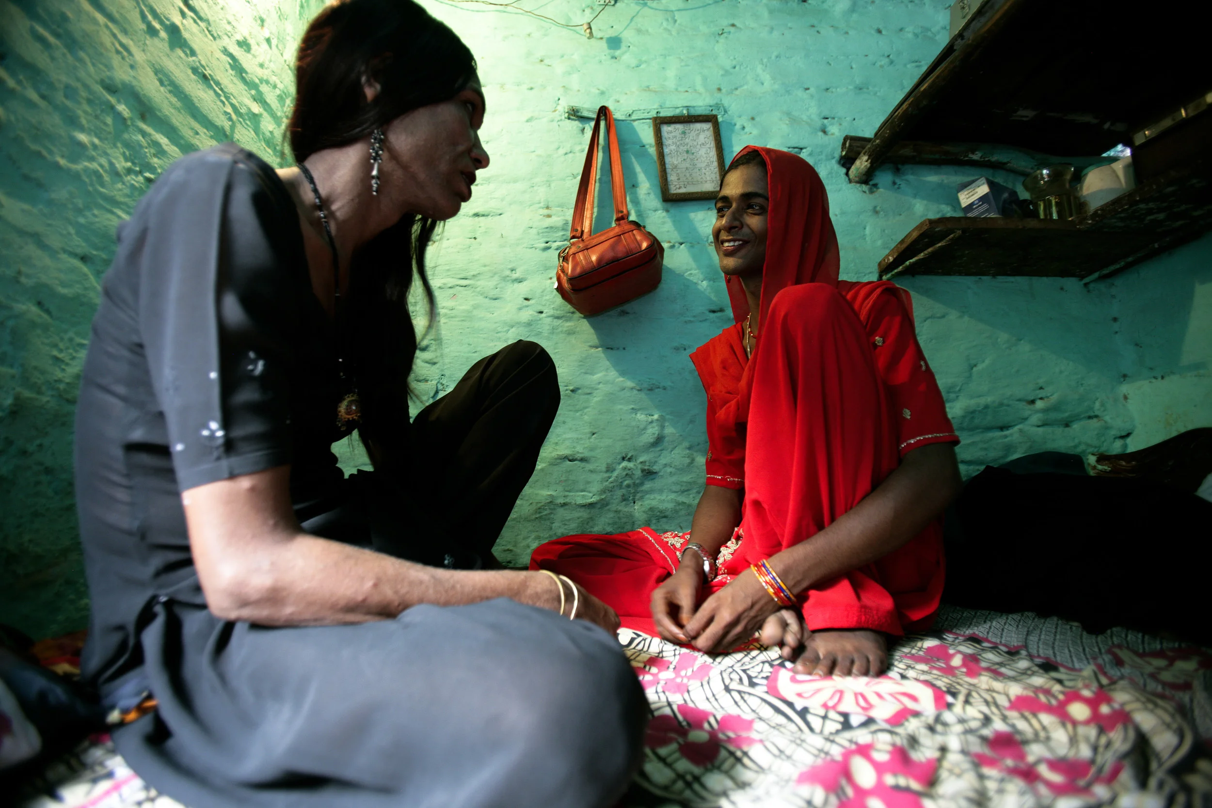 Delhi India, June 2006: HIV+ Trans-gendered sex workers with a history of drug use counsel each other in a slum in Delhi. These men support wives, children, boyfriends and are the only people in their groups who earn money. They feel that they are unable to stop their sex work but are trying to implement safe sex techniques to curb their spreading of the HIV virus. This is very difficult with Indian men who do not want to use condoms.