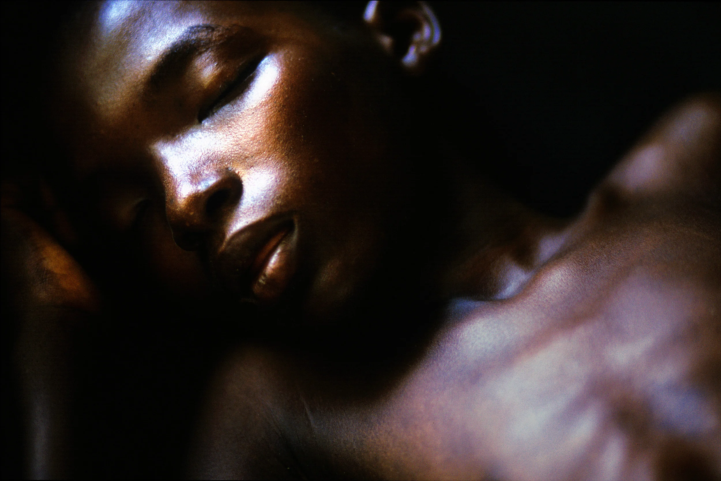 Kono, Sierra Leone, June 2003: A young boy sleeps fitfully while fighting off a bout of Malaria without access to malarial prophilactics. Malaria remains one of the 3 most deadly diseases, infecting 500 million people every year, killing a few million of that sum, most of the victims are children
. It is directly linked to mosquito habitats in stagnant water, often the only water source available to third world inhabitants.