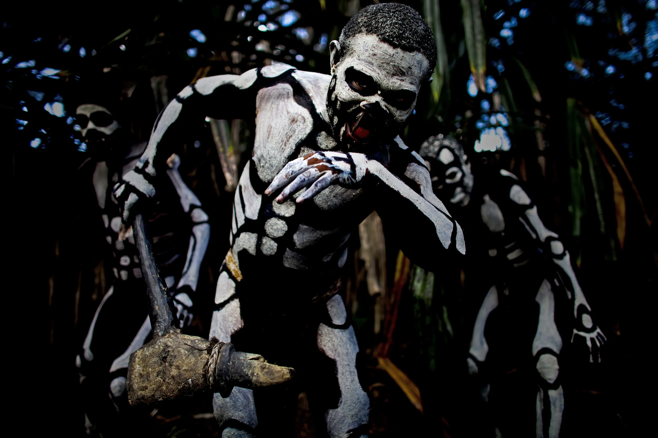 MINDIMA VILLAGE, CHIMBU PROVINCE, HIGHLANDS, PAPUA NEW GUINEA-DECEMBER 2008: A Papua New Guina highland tribal ceremony depicting images of "Spirit Men," also known as "Skeleton Men" attacking an evil forest Spirit known locally as the Omo Masalai, in a village in Chimbu Province, Highlands, Papua New Guinea, 18 December 2008. Legend has it that the skeleton men are the formerly human victims of the forest spirit who attacked and ate them. The skeleton men are seen in the act of vengeance against the Forest Spirit monster. (Photo by Brent Stirton/Reportage by Getty Images.)