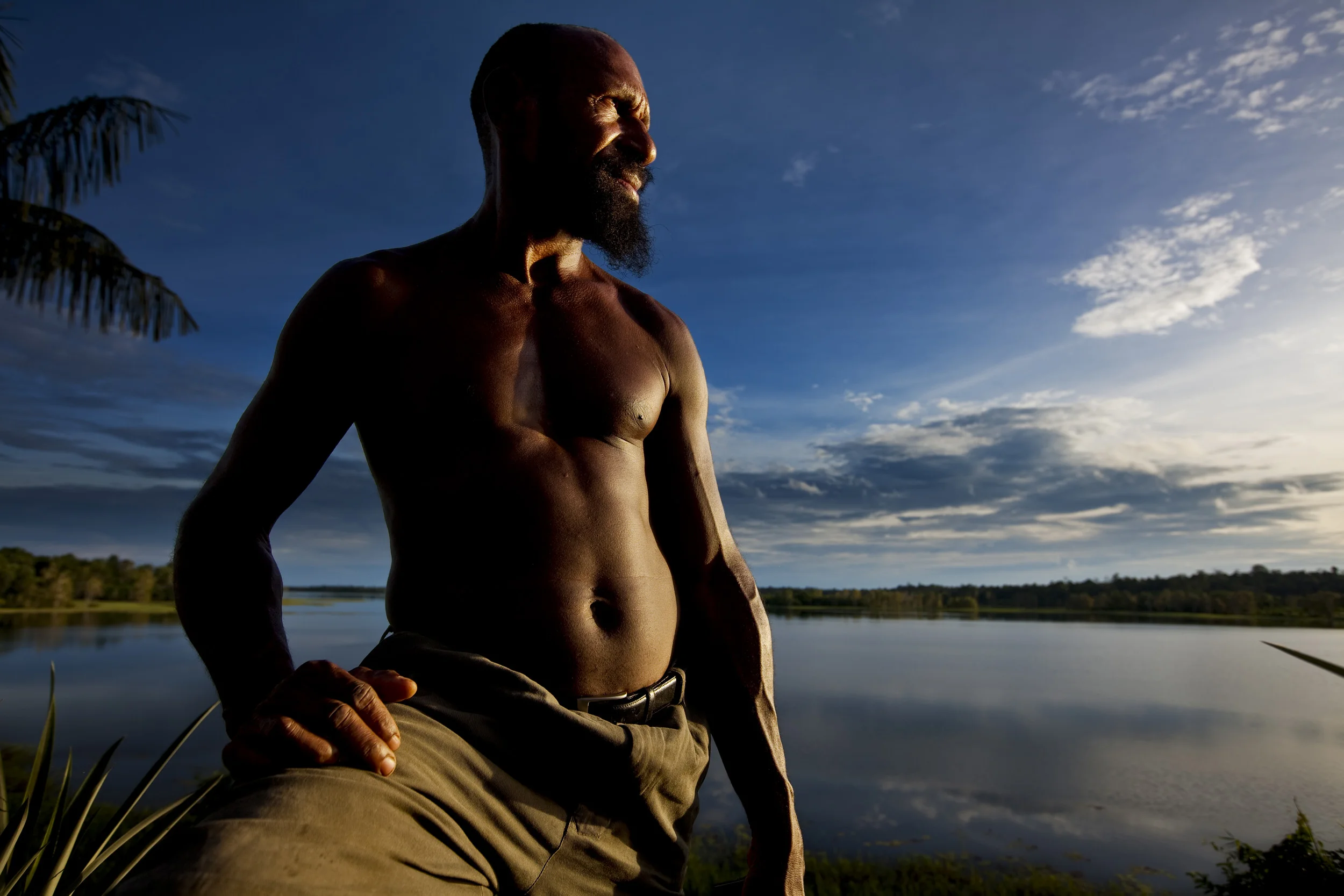 LAKE MURRAY, WESTERN PROVINCE, PAPUA NEW GUINEA-JANUARY 2008: Galeva Sep, a former policeman turned environmental activist photographed at Kubut Village, Lake Murray, Papua New Guinea, 1 January 2009. Sep organised his community to expel exploitative Malaysian loggers and now runs his own eco-logging practise. Lake Murray is a region where people have lived lives in harmony with nature for centuries. People make their living by hunting, farming, fishing, and growing rubber trees and now also with Eco-forestry. Their life-styles are dependant on the harmony between them and nature and they are trying to ensure a sustainable relationship for future generations. This has been complicated and compromised by the interventions of both international mining and logging groups over the last few decades but local community resistance is growing as rising anger mounts at the environmental damage done to rivers and forests which form the backbone of the village survival system. (Photo by Brent Stirton/Reportage by Getty Images.)