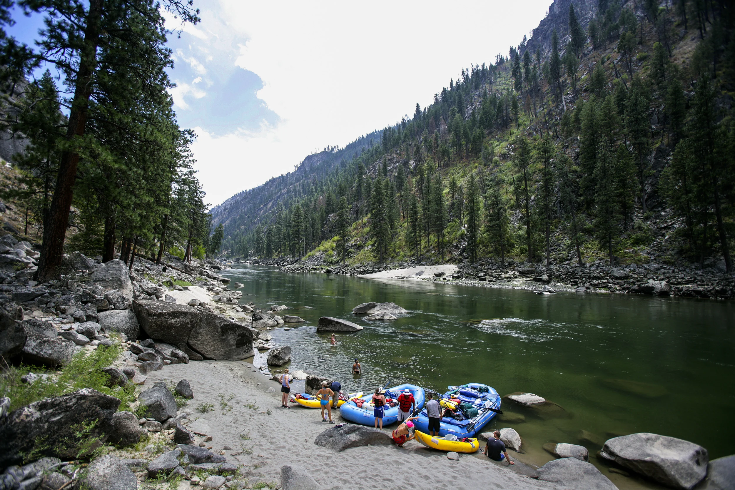 SALMON RIVER IDAHO - AUGUST 8/14 2006: A rest stop on the Main Salmon river in Idaho on a river rafting trip for disabled veterans of the Iraq, Afghanistan conflicts.These images focus on a week in the life of three disabled war wounded veterans from the Iraq, Afghanistan conflicts. The three men are Major Anthony Smith,39, an African American man who was severely wounded in the hip in Iraq while on deployment. He is missing an arm, is recovering from 4 bullet wounds and has only partial use of his right leg and hip after being struck by an RPG. Damien Jocobs,30, is a Marine Staff Sergeant with a below the knee amputation as a result of an IED explosion in Iraq. Andy Soule, 25, is a specialist who was blown out os his vehicle by an IED in Afghanistan. Andy is a double above the knee amputee.
Higher Ground is a program run by Sun Valley Adaptive sports in Kethum Idaho. They are an NGO looking to provide a sports based meaningful rehabiliation experience for disabled veterans. The program involved taking the men, all of whom are amputees of sorts, down the Main Salmon River on a 4 day river rafting trip and then offering them the opportunity afterwards to pursue futher sporting intersts such as climbing, parasailing, kayaking and horse-riding. The program also encourages disabled veterans to bring their wives on the program. It is aimed at a healthier and speedier recovery through outdoor recreation.