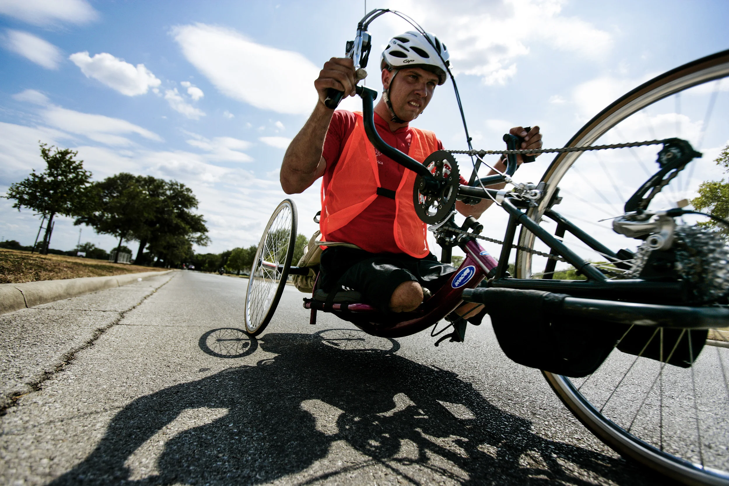 San Antonio, Texas, 23 August 2006: Specialist Andrew W. Soule, 25, is a double amputee rehabilitation patient at Brooke Army Medical Centre. Soule is pictured using an adaptive handcycle on a bike route around the military base. The bikes are part of a program run by the San Antonio Park's and Recreation department. Spc Soule is a quiet but positive patient and excels at all of the rehabilitative sports programs he takes part in. He lost his legs to an IED explosion in Afghanistan which blew him out of the vehicle and claimed his legs. Brooke Army Medical Centre is one of the most advanced facilities in the world for the healing and rehabilitation of amputees and severe burn victims. Photo by Brent Stirton/ Getty Images for Newsweek.