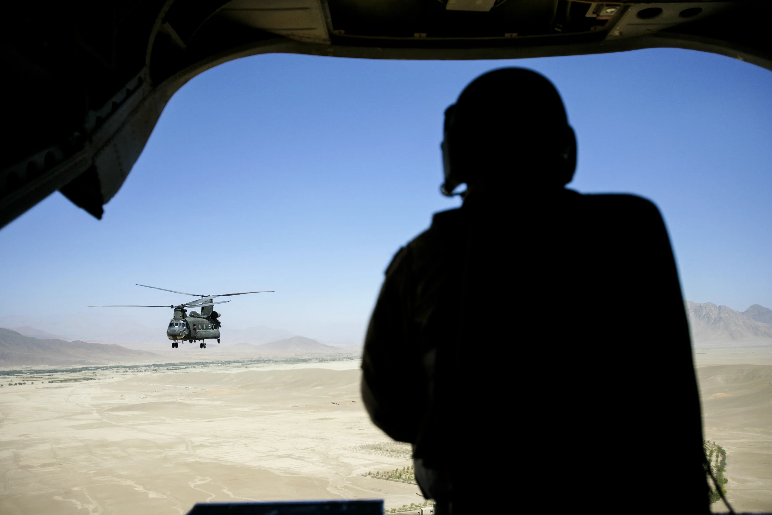 Kabul, Afghanistan, September 11, 2006: CNN Anchor Anderson Cooper, Field producer Charlie Moore, Photojournalist Phillip Littleton and Senior International Correspondent Nic Robertson, Senior Producer Henry Schuster and photojournalist Todd Baxter fly to US foward operating base Bermel in the Paktika Province in Afghanistan. The CNN crews shot the 9/11 anniversary at the base.
Photo by Brent Stirton/Getty Images