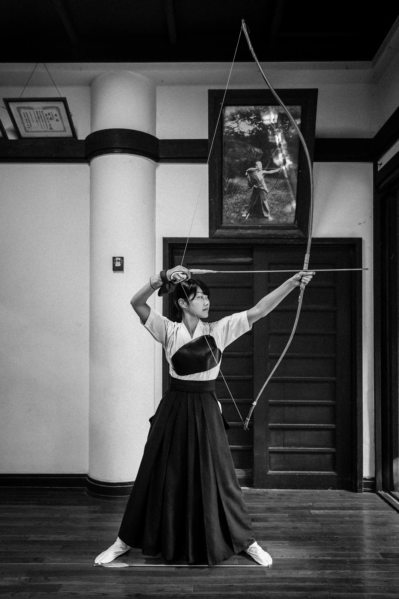 TOKYO UNIVERSITY, TOKYO, JAPAN, 25 OCTOBER 2014: Tokyo University Kyudo club in action at the University dojo, Tokyo, Japan. Kyudo is much more a moving meditation than a sport of archery, with an emphasis on breath, perfection of movement than an attempt to hit the target. It is seen as one of the most static of the Bushido Samurai arts. These young students all talk about the beauty and the meditative aspects of the sport and not the actual target shooting. All of the Samurai arts have aspects which stress these points of technique, artistry and flow. (Photo by Brent Stirton/Reportage by Getty Images for Le Figaro.)