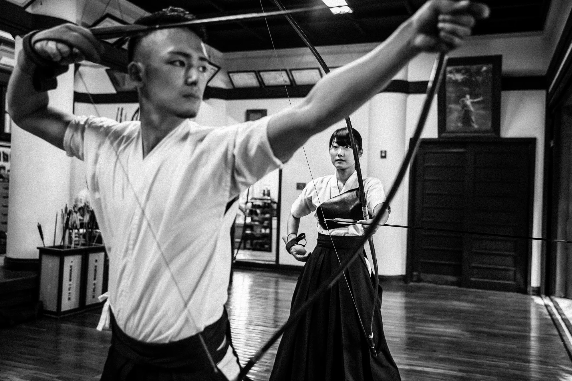 TOKYO UNIVERSITY, TOKYO, JAPAN, 25 OCTOBER 2014: Tokyo University Kyudo club in action at the University dojo, Tokyo, Japan. Kyudo is much more a moving meditation than a sport of archery, with an emphasis on breath, perfection of movement than an attempt to hit the target. It is seen as one of the most static of the Bushido Samurai arts. These young students all talk about the beauty and the meditative aspects of the sport and not the actual target shooting. All of the Samurai arts have aspects which stress these points of technique, artistry and flow. (Photo by Brent Stirton/Reportage by Getty Images for Le Figaro.)