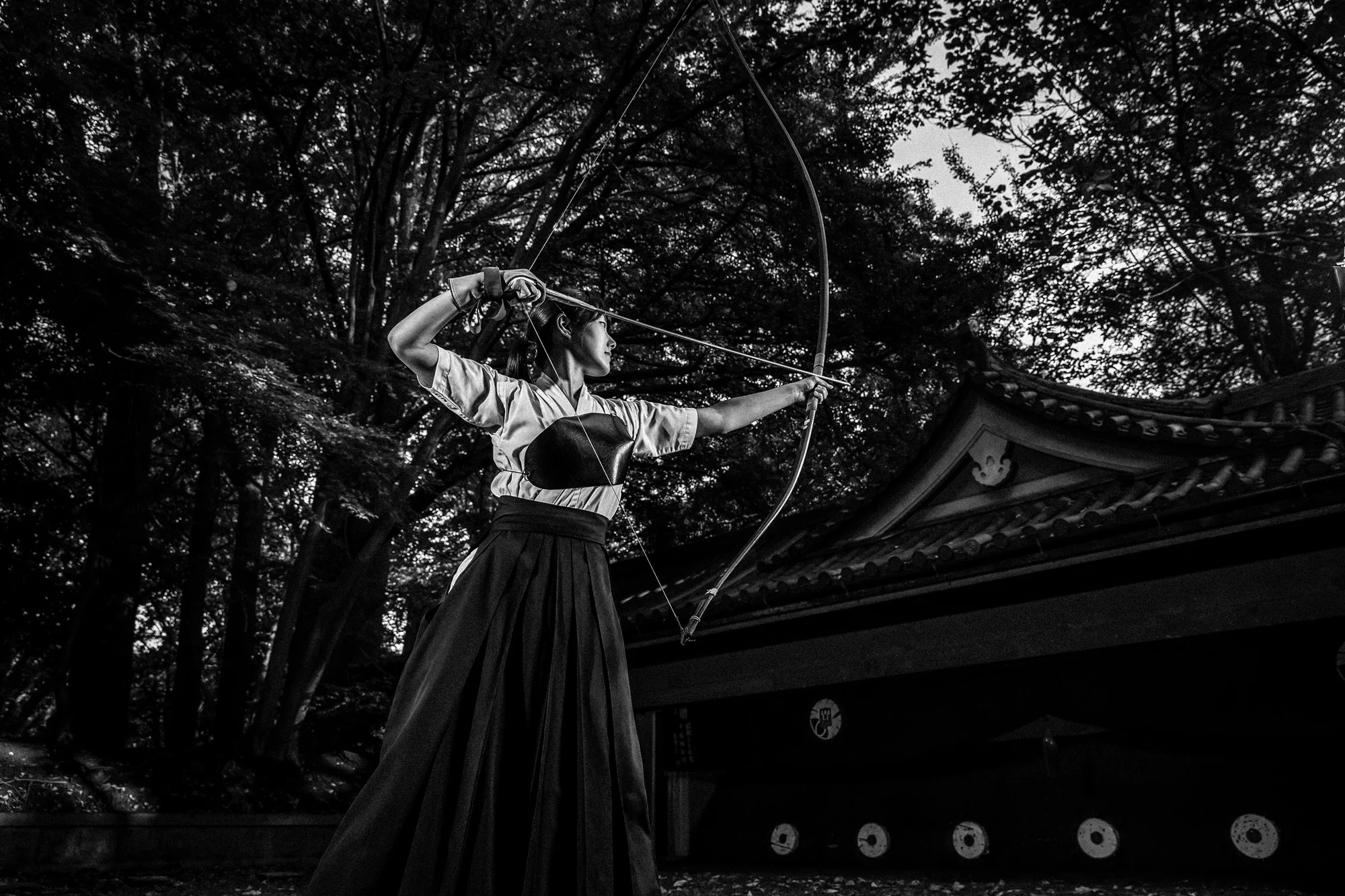 TOKYO UNIVERSITY, TOKYO, JAPAN, 25 OCTOBER 2014: Tokyo University Kyudo club in action at the University dojo, Tokyo, Japan. Kyudo is much more a moving meditation than a sport of archery, with an emphasis on breath, perfection of movement than an attempt to hit the target. It is seen as one of the most static of the Bushido Samurai arts. These young students all talk about the beauty and the meditative aspects of the sport and not the actual target shooting. All of the Samurai arts have aspects which stress these points of technique, artistry and flow. (Photo by Brent Stirton/Reportage by Getty Images for Le Figaro.)