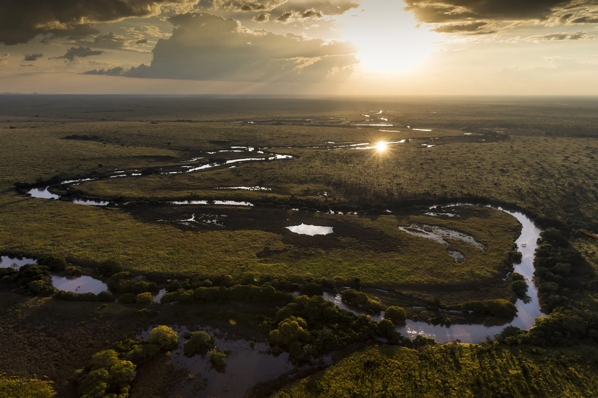 GARAMBA NATIONAL PARK, DEMOCRACTIC REPUBLIC OF CONGO, 12 NOVEMBER 2014: Scenes flying over Garamba National Park, DR Congo. The park is a vast area and is difficult terrain to police for a small force of ICCN rangers. The area to the West is the Azzande hunting concession and the preferred route of the LRA into Garamba. There are a number of river crossings and a high number of swamps, all contributing to the difficulty of policing Garamba against a seasoned forced like the LRA, who are used to the bush and toughened by years of living in these conditions. (Photo by Brent Stirton/Reportage by Getty Images for National Geographic magazine.)