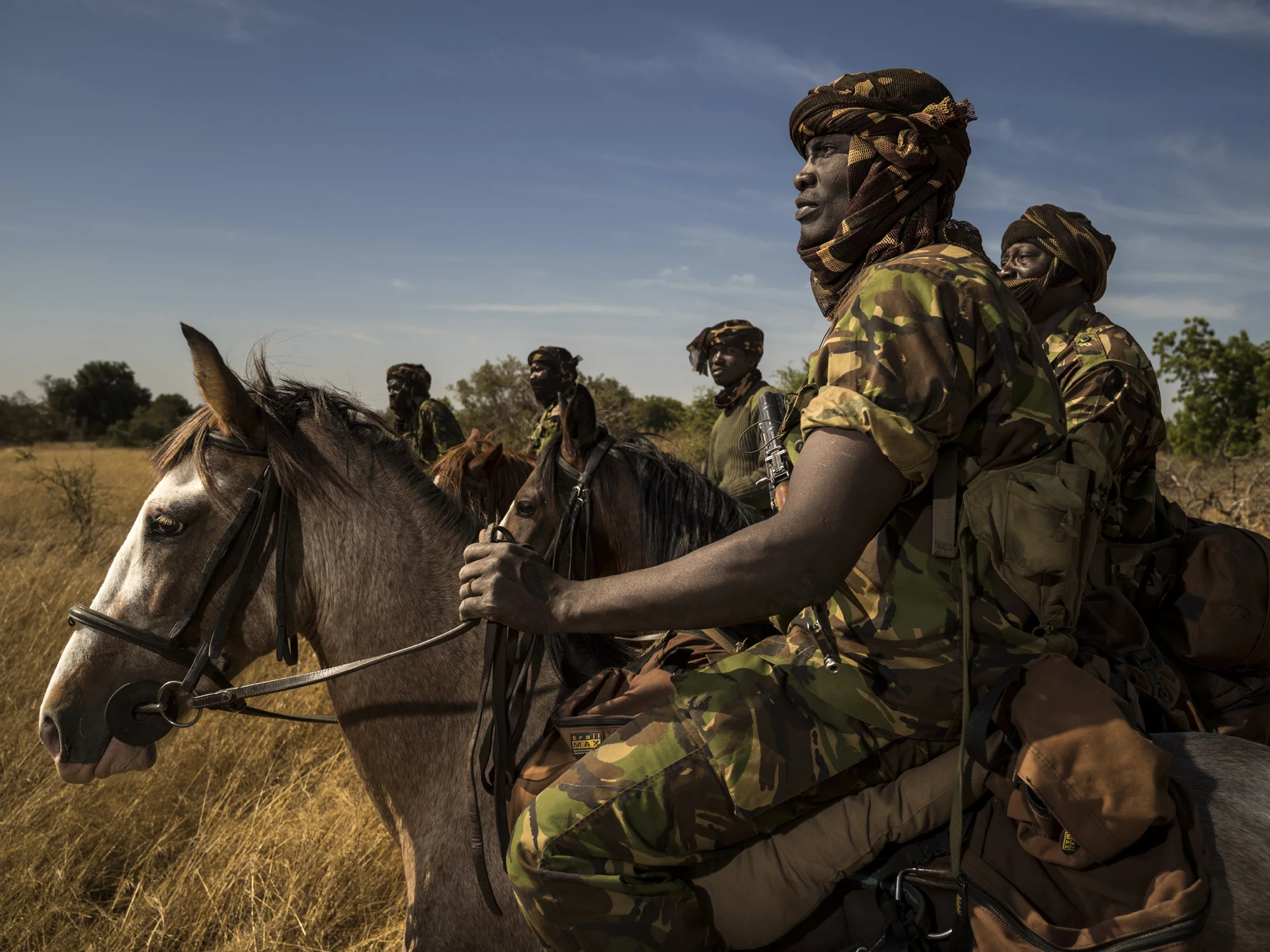 ZAKOUMA NATIONAL PARK, CHAD, 7 JANUARY 2015: The "Wild Dog" Ranger horse patrol group as it prepares to leave for a week of anti poaching patrol at Zakouma National Park, Chad. The horse patrols are the old guard of Zakouma's rangers and have seen a good deal of conflict in their time in the park. Zakouma lost nearly 75% of its elephants in the decade before 2011 due to raids by Janajaweed and Sudanese poachers, many of them from the Sudanese military. The president of Chad, Idris Deby, is a big supporter of the elephant of Zakouma and of its elephants. The herds here until recently used to be as large as 1000 animals all moving together, severe poaching over the last decade saw that number decimated and now only around 20% of the number remains. Since 2011 however there has been control over poaching and there has not been a single elephant poached in the last 2 years. The president of Chad, Idris Deby, is a strong supporter of the park and Zakouma is on the upsurge in terms of its elephant population once again. (Photo by Brent Stirton/Reportage for National Geographic Magazine.)