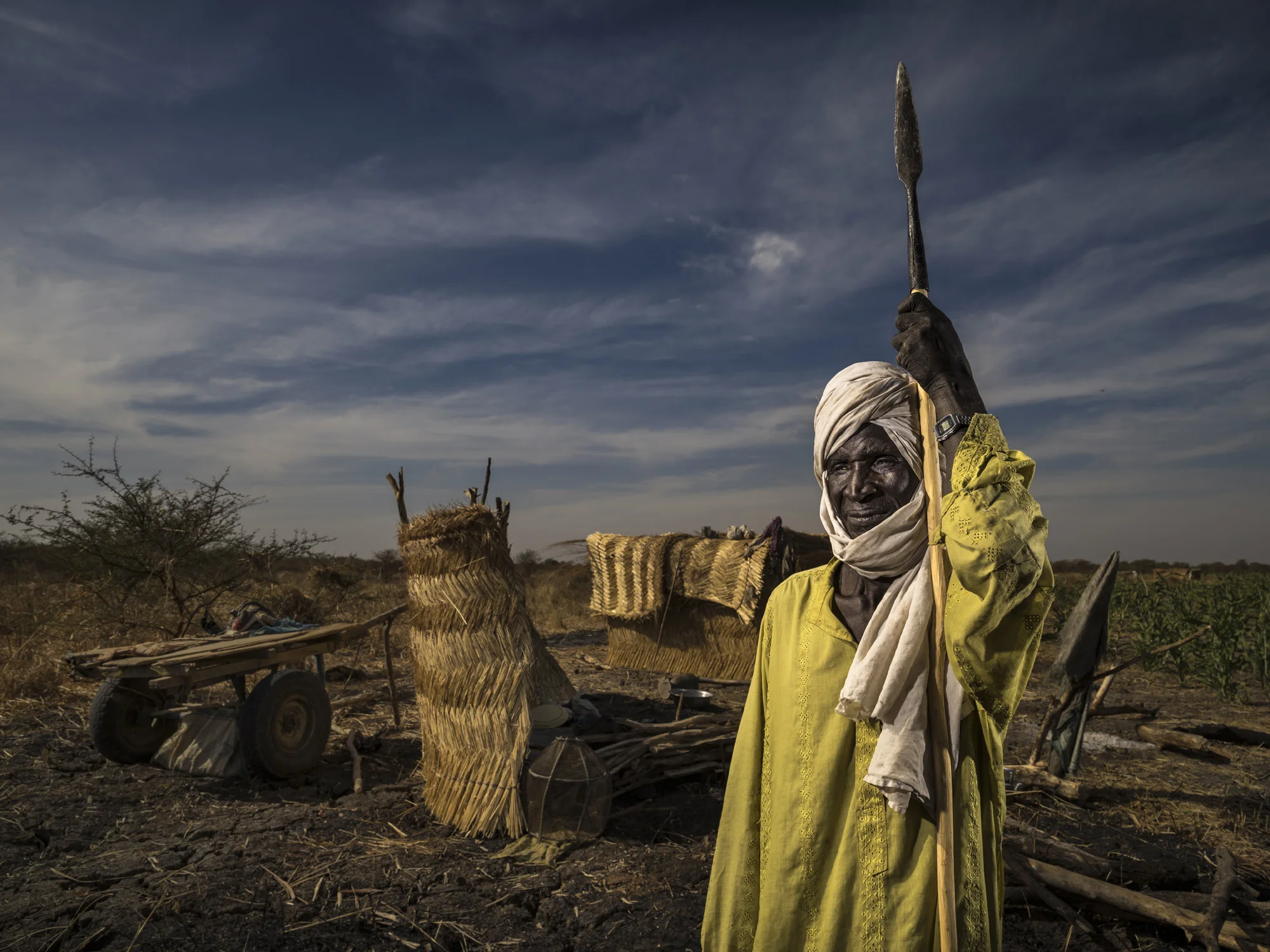 ZAKOUMA NATIONAL PARK, CHAD, 6 JANUARY 2015: Djime Said, 50, the lone survivor of the Ranger massacre at Heban, Chad, on the 3rd September 2012. The rangers were killed by poachers who were members of the Sudanese military. They killed the rangers because a few weeks earlier, the Rangers had found their camp and taken all their ammunition, horse and provisions. The attack occured in the very early morning when it was still dark and the Rangers were sleeping. Djime Said was employed as a cook with them in the rainy season. He said there was suddenly heavy firing out of nowhere and he found himself rolling down the steep hill that made up the Ranger post at Heban. He was shot in the buttocks but managed to hide away for the day and then come back to the camp that night where he confirmed all were dead and the camp looted. Said spend the next week trying to get to help, two days of which were spent wading through a dense swamp on his way to aid. He received $2000 compensation from the Chadian government for his injuries. (Photo by Brent Stirton/Reportage for National Geographic Magazine.)