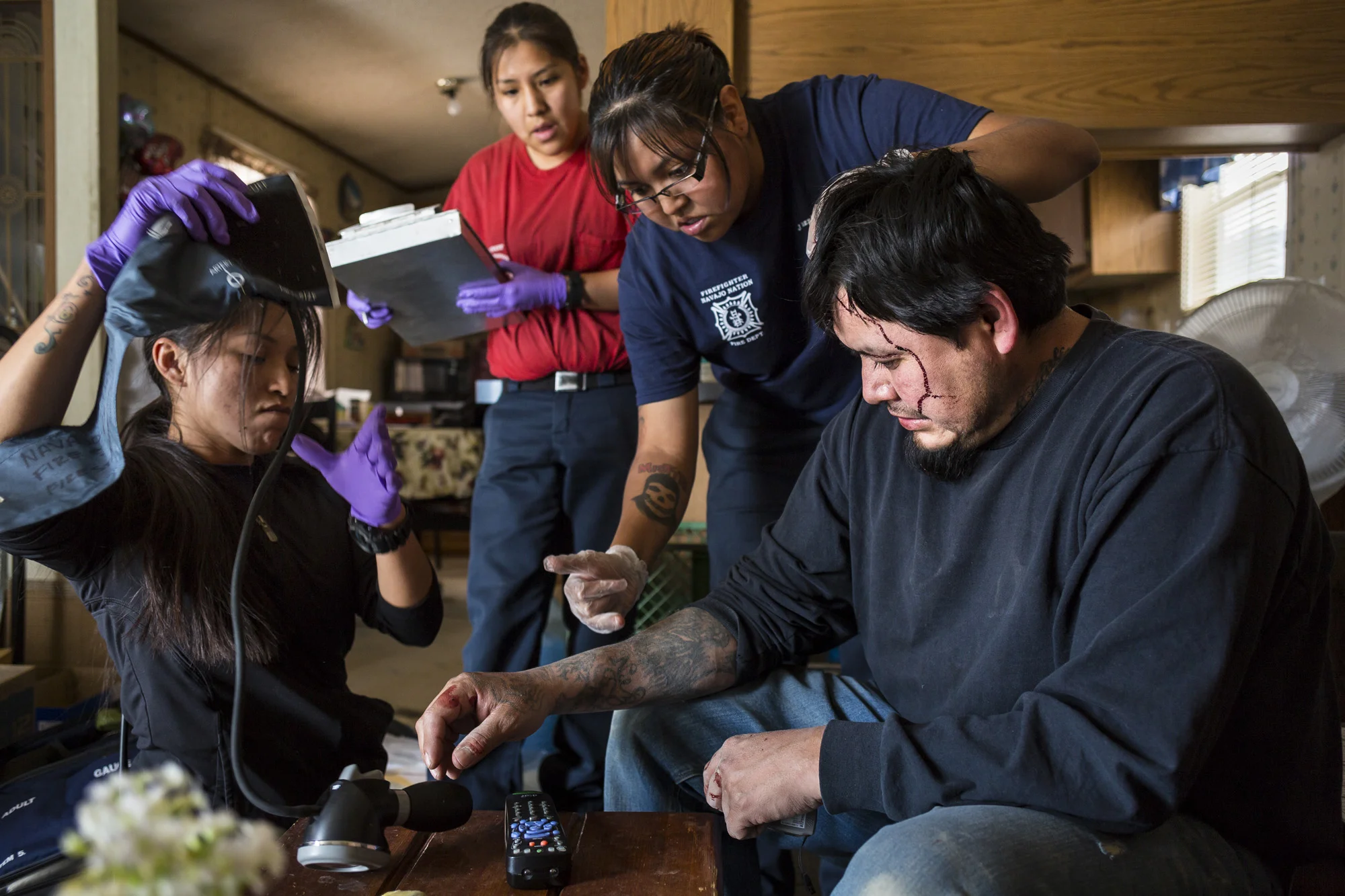 WINDOW ROCK, ARIZONA, 11 APRIL 2014: Navajo EMT emergency workers attend to a man who was assaulted by his brother in WindowRock, Arizona. both were intoxicated at the time, alcohol is illegal on the Navajo reservation but is the chief cause of violence. (Photo by Brent Stirton/Reportage for Le Figaro.)