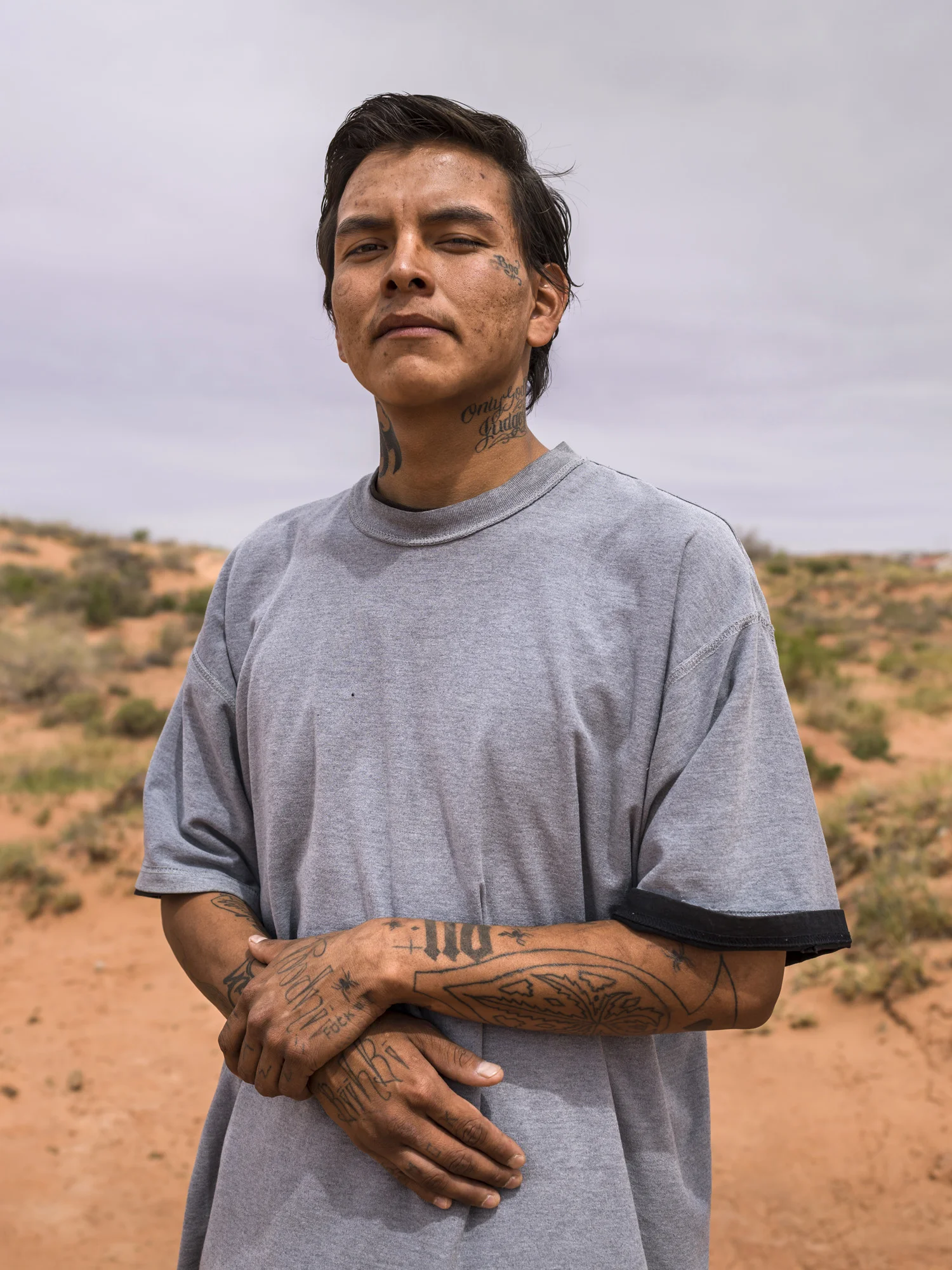 TUBA CITY, ARIZONA, 16 APRIL 2014: Virgil Frank Martinez Jr, 22, seen on the outskirts of Tuba City in a poor part of the town. Tattoos are common on Navajo youth and do not necessarily suggest gang affiliations. (Photo by Brent Stirton/Reportage for Le Figaro Magazine.)