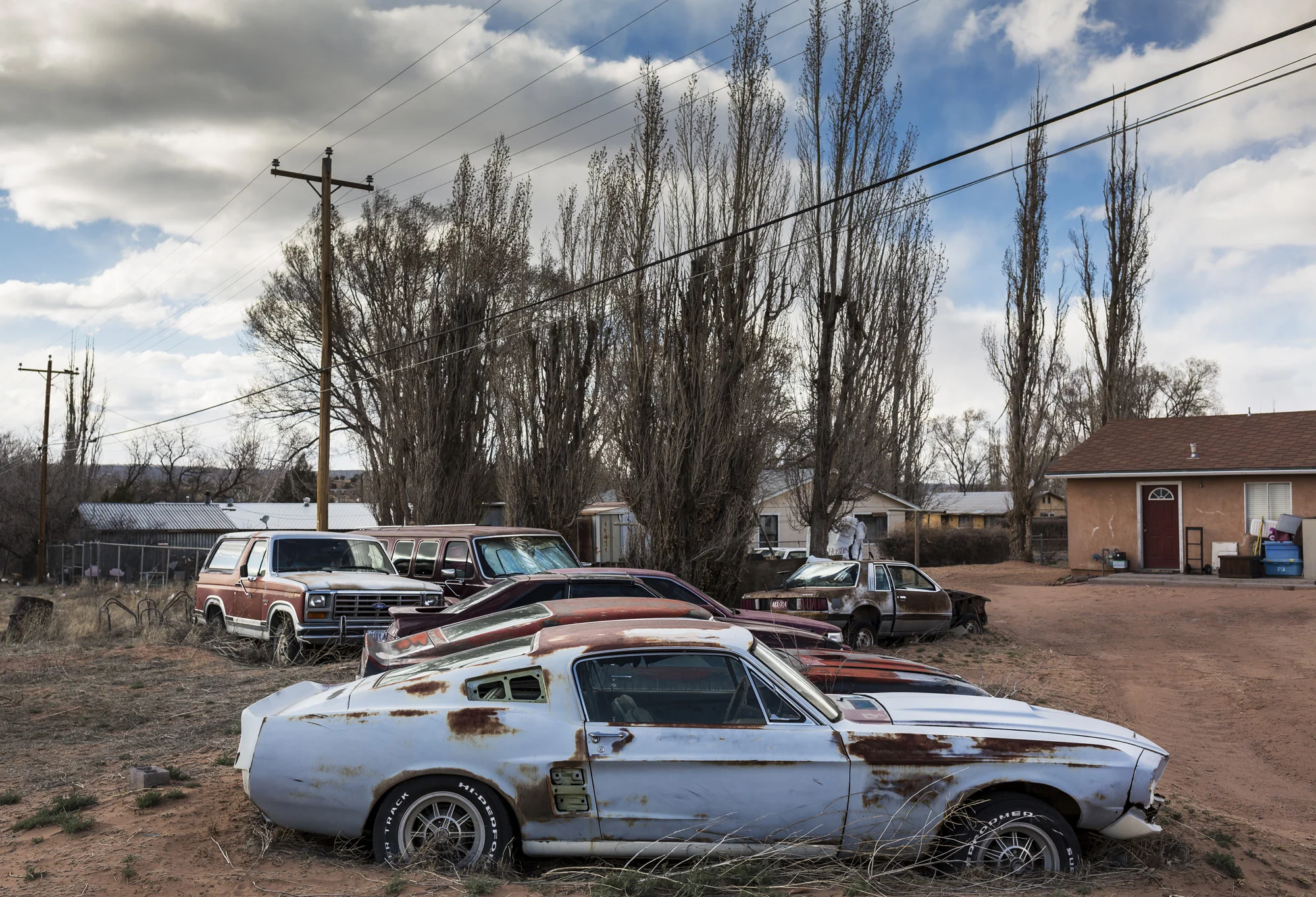 WINDOW ROCK, ARIZONA, 11 APRIL 2014: Valuable vintage American muscle cars lie rusting in a yard in the economically deprived Navajo Capital of WindowRock, Arizona. (Photo by Brent Stirton/Reportage for Le Figaro.)