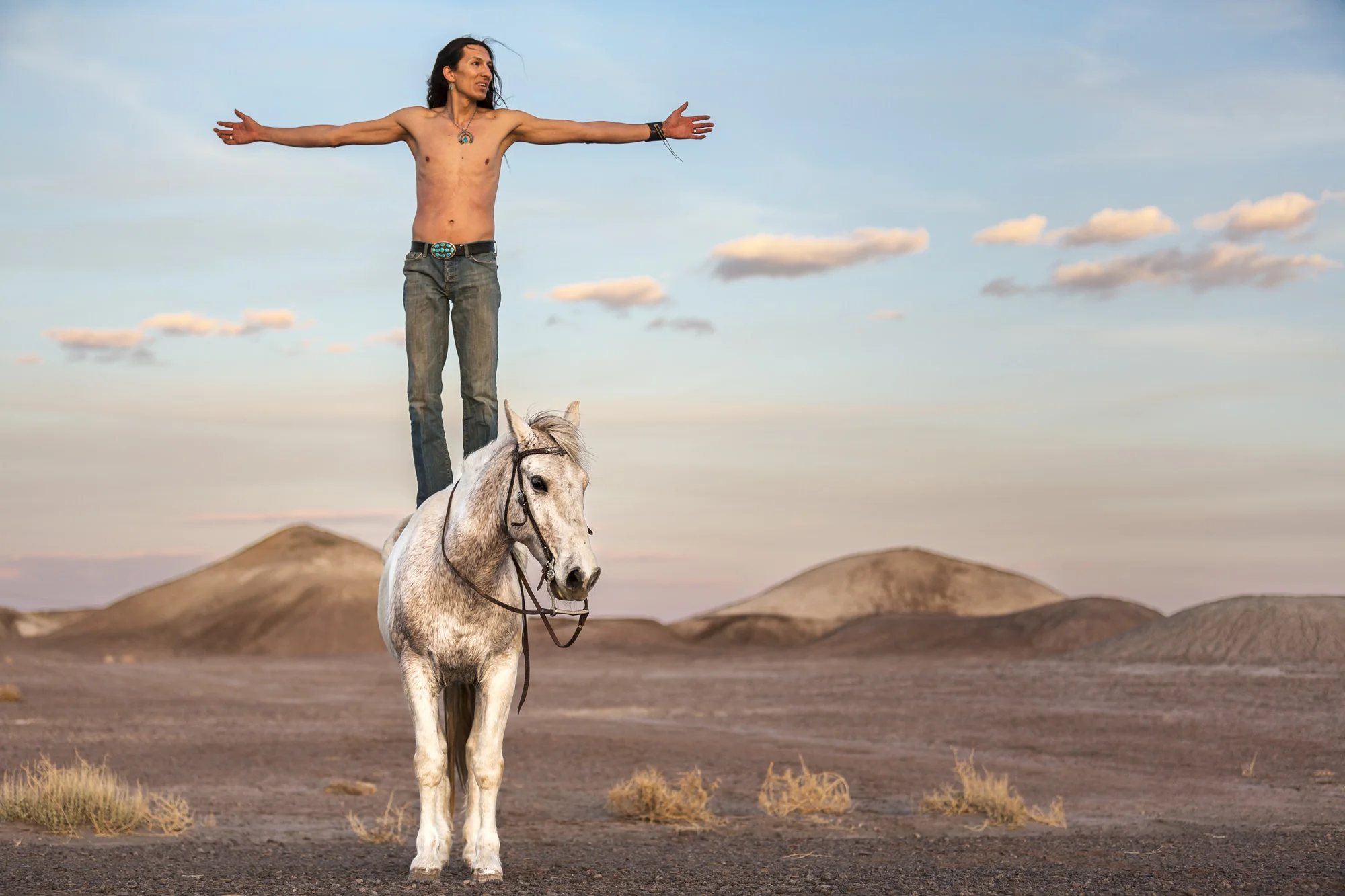 CAMERON, ARIZONA, 16 APRIL 2014: Claysun Benally with his horse in Cameron, Arizona. Claysun is a strong believer in traditional Navajo values and along with his father keeps several horses on their property in Flagstaff. The Navajo have a long relationship with the wild horse, a relationship characterized by gentleness and agreement rather than breaking the horses spirti to the will of man. (Photo by Brent Stirton/Reportage for Le Figaro Magazine.)