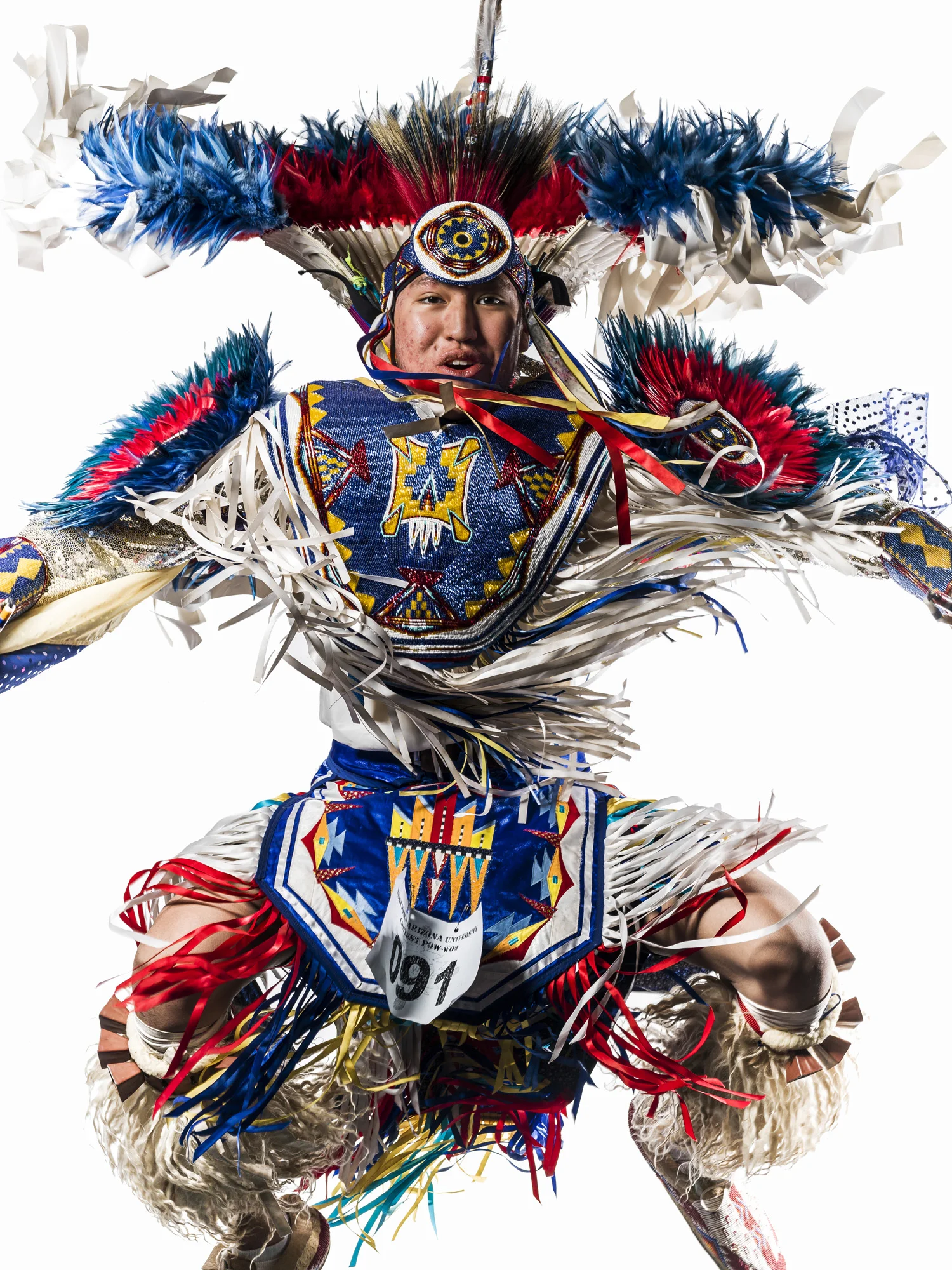 FLAGSTAFF, ARIZONA, 13 APRIL 2014: Images from a multi-tribe Pow Wow held in Flagstaff Arizona. These dancers come from all over America, the portraits are of Navajo dancers. Their costumes are not traditional however and have come to portray an almost "Super-Indian" collective today. (Photo by Brent Stirton/Reportage for Figaro Magazine.)
