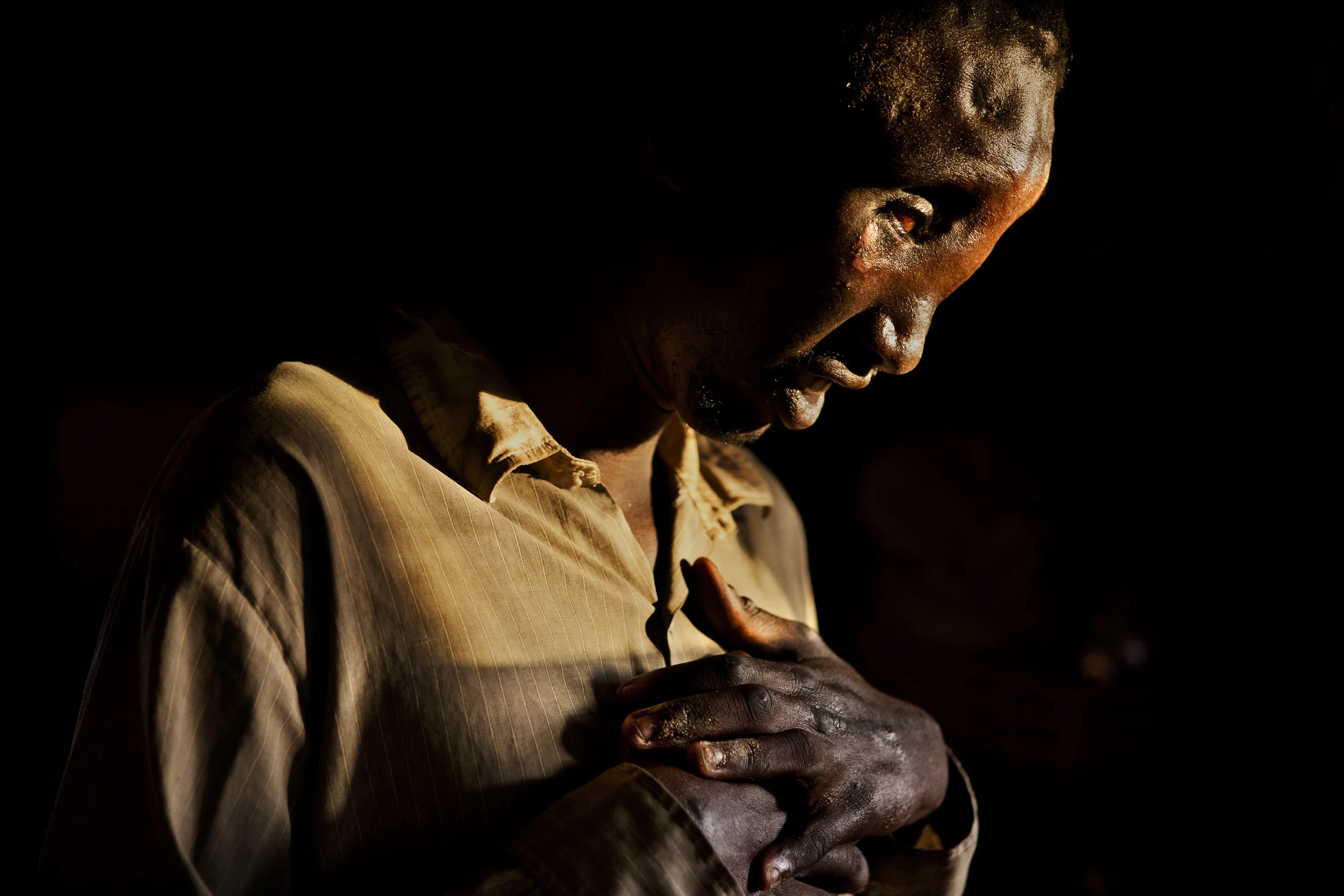 LAKE TURKANA, NORTHERN KENYA, MAY 2010: A mentally handicapped Dasenetch man, Michael, 20, in Lake Turkana North Kenya, 20 May 2010. A lack of any access to medical care resulted in brain damage when Michael was born. It remains an important priority for pastoralist tribes all over Kenya to have access to medical care in their communities in order to secure the well being of their people. The cost of this is driving many pastoralists to abandon traditional cattle practises and adopt other economic pursuits in order to cope with the pressures of their changing lives. (Photo by Brent Stirton/Reportage by Getty Images.)