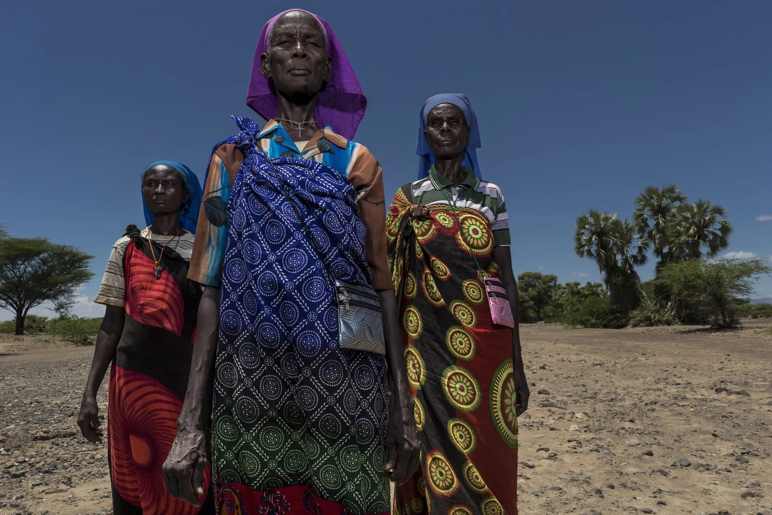 LOWARENGAK, TURKANA, KENYA, 10 OCTOBER 2014: Three elder ladies who are members of "Legion of Mary" in Lowarengak, Turkana, Kenya. Relegion has had a profound effect on the Turkana pastoralists, changing the nature of their belief systems and in some cases, their way of life. (Photo by Brent Stirton/Reportage by Getty Images for HRW.)