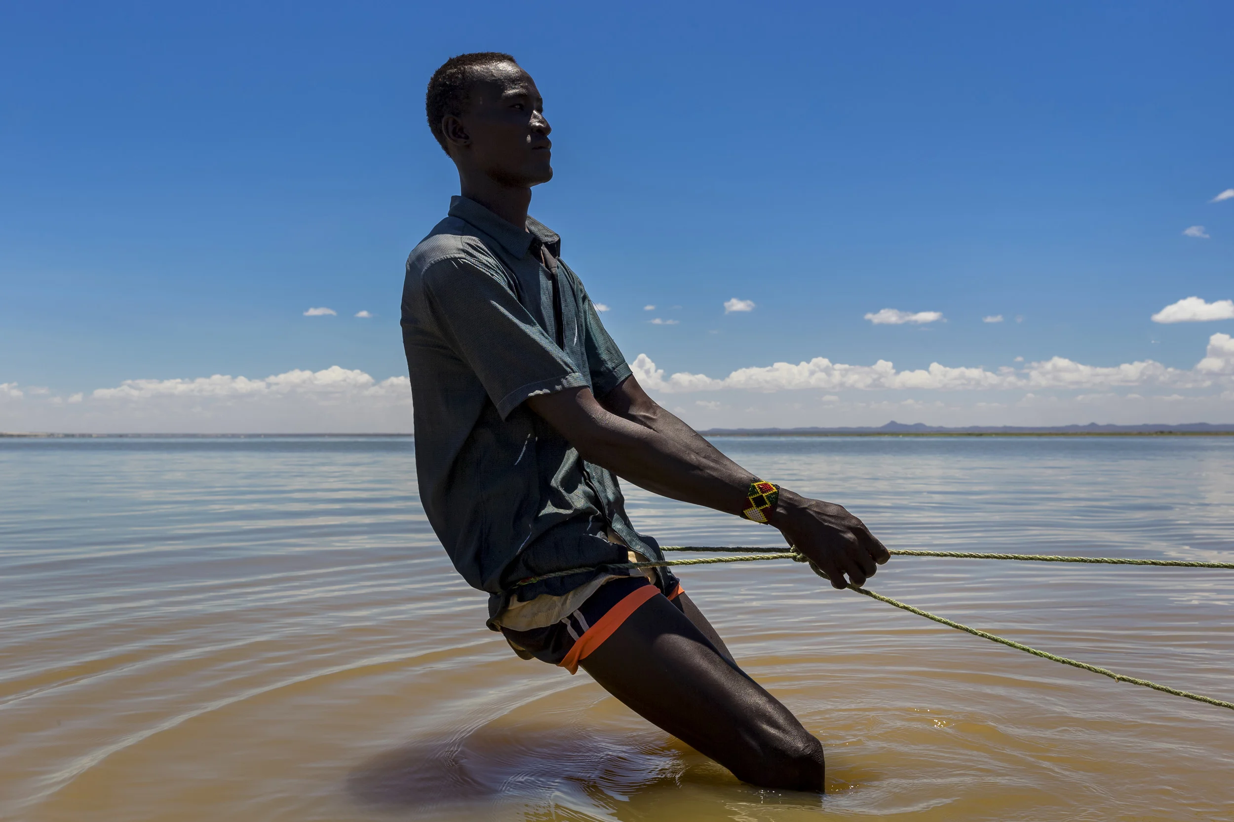 TURKANA, KENYA, 8 OCTOBER 2014: Scenes from Longetch fishing village on the shores of Lake Turkana, Kenya, the world's largest inland desert lake. This region of the lake is a well know spawning ground and at the heart of fishing commerce for the Turkana. These villagers along with many thousands along the shores of this vast body of water are soley dependent on the lake for their survival. The Turkana are traditionally pastoralists but persistent droughts have decimated their herds to such an extent that for many Turkana fishing is now their main means of subsistence and commerce. The same pattern is emerging for other tribes along the lake shore. Recent dam building in Ethiopia is likely to bring the Omo river to one fifth of its current flow, sugar cane farms along the Omo are already causing tribal movement down to Lake Turkana as pastoralists struggle for grazing and water rights. The Omo river supplies 90% of Lake Turkana's water and these dams and sugar cane farms look likely to severly impact the renewal of the lake's waters. This threatens all the tribes around the lake and makes conflict over diminishing resources ever likely. (Photo by Brent Stirton/Reportage by Getty Images for Human Rights Watch.)
