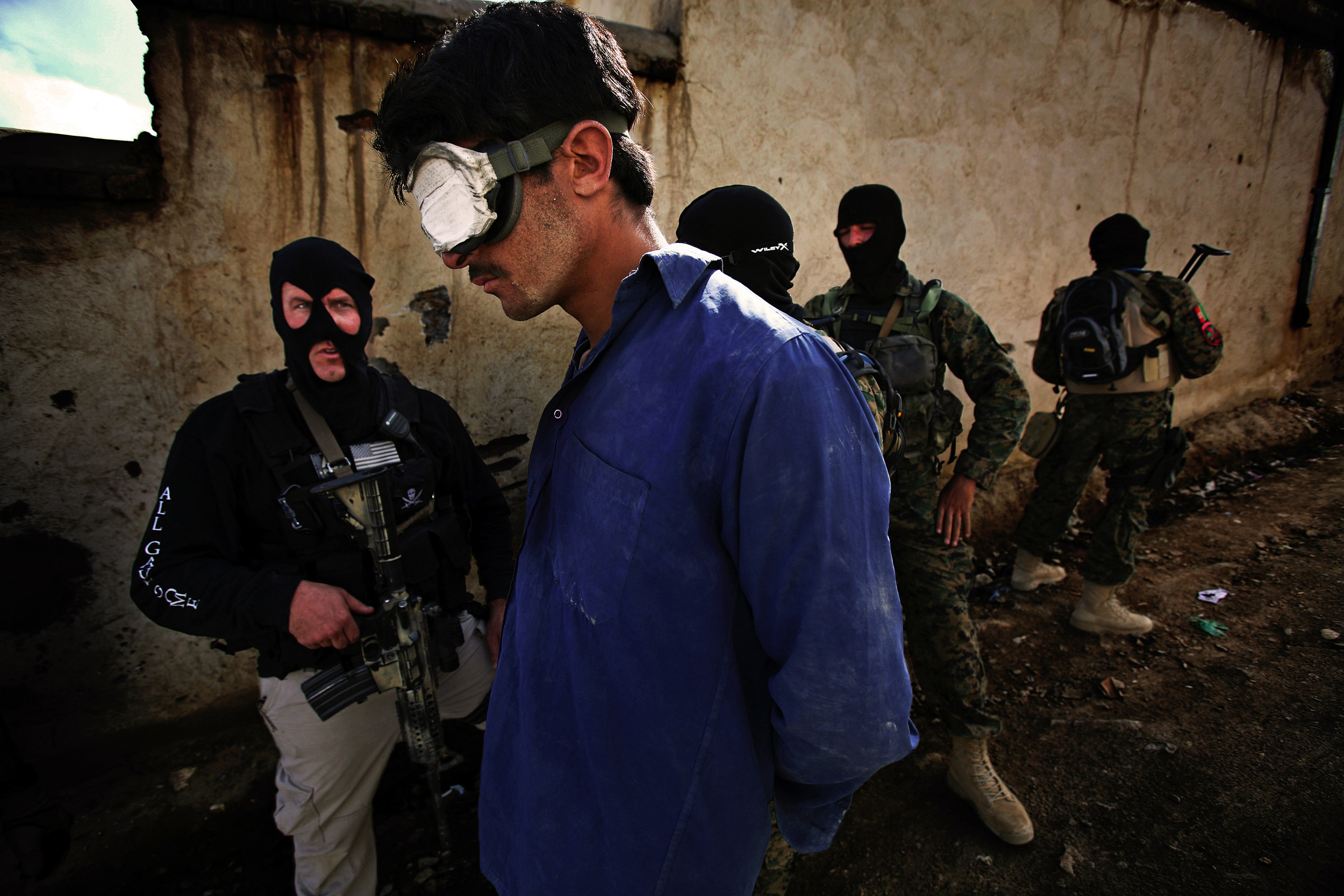 KABUL, AFGHANISTAN-APRIL 2007: Scenes from a drugs bust conducted by the Afghan Anti-Narcotics unit assisted by American DEA agents who have been training these men for over 2 years, Kabul, Afghanistan, 18 April 2007. The images show a search scene