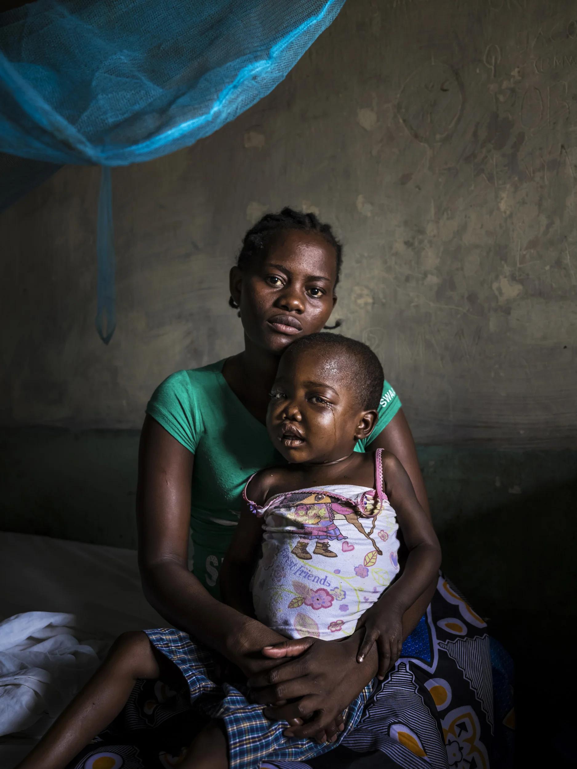KISUMU, KENYA, 21 JUNE 2015: Shelvine Achreng is sick with Leukemia and Sickle Cell disease. Her parents are impoverished farm labourers who cannot afford transport to the appropriate hospital, let alone the costs of treating Shelvine's condition. Victims of this kind of disease amongst Africa's poor are destined to die without outside intervention. Non-Communicable diseases like Cancer, Hypertension and Diabetes are on the rise in Africa, adding to the strain the more traditional diseases already place on populations. Poverty only serves to increase fatalities amongst the poorest of these. (Photo by Brent Stirton/Novartis)