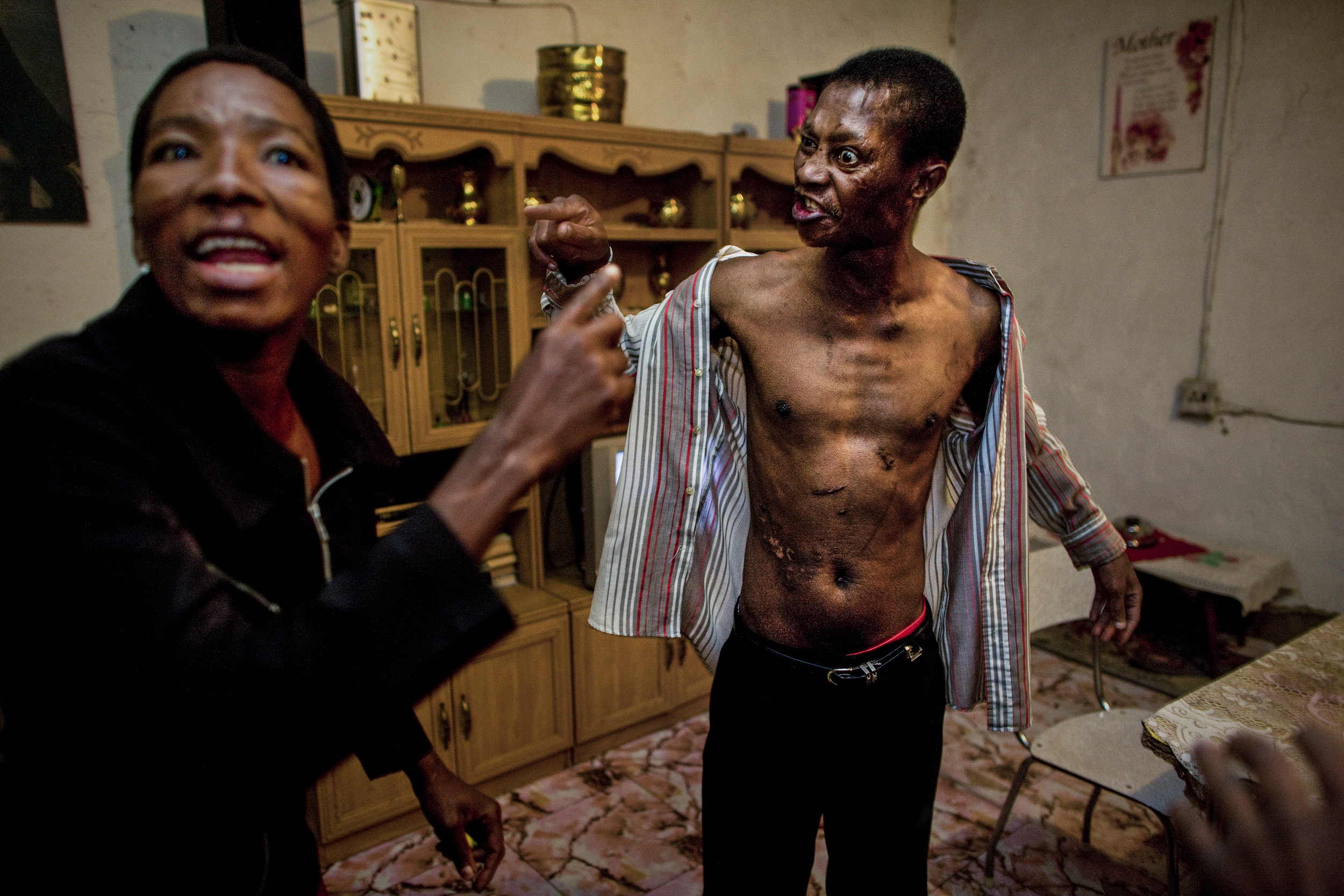 ALEXANDRA TOWNSHIP, JOHANNESBURG, SOUTH AFRICA - JUNE 7: The Alexandra township Crime Prevention Forum member's patrol confront scenes of domestic violence, June 7, 2008 in Alexandra township, South Africa. The patrol does not receive the backing th