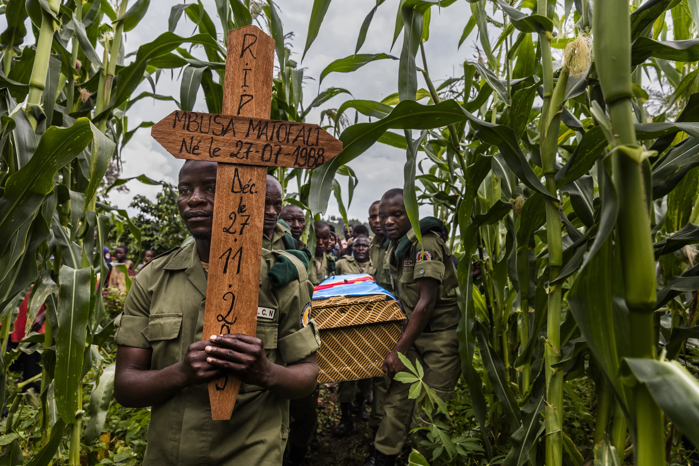 RUMANGABO, NORTH KIVU, DEMOCRATIC REPUBLIC OF CONGO, 28 NOVEMBER 2015: The funeral of ICCN Ranger Theodore Mbusa Matofali, 27, after a tragic car accident which left him dead from head injuries. Over 150 ICCN rangers have died in the course of their duties in Virunga National Park, most of those deaths have resulted from conflict. The Rangers have a dangerous job, often dealing with rebel movements, paramilitary Mai-Mai groups as well as the Congolese army all in the name of conservation in this contentious region of the DRC. (photo by Brent Stirton/Reportage for National Geographic Magazine.)
