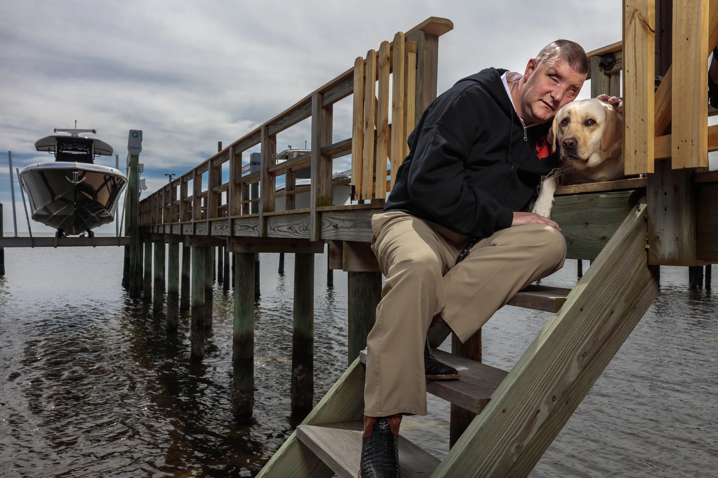 ST PETERSBURG, FLORIDIA, USA, 21 MARCH 2016: Marine Cpl. Michael Jernigan was five weeks from leaving Iraq when an improvised explosive device mangled his right hand and left knee, shattered his entire forehead, destroyed both eyes and left him with a traumatic brain injury. The shrapnel from two rigged 105 shells blew him twenty meters out of the gun turret of the Humvee he was in, passing straight through his right eye and out of his left. This was on August 22, 2004. He became the first US serviceman to lose both eyes in combat in Iraq. Michael underwent 30 surgeries over 12 months enduring tremendous pain and trauma. He eventually had a Bilateral Anucleation where the remains of both eyes were removed and spacers were implanted. One of his optical nerves is badly damaged, the other remains intact. He has no sight whatsoever. Michael is seen in his hometown of St Petersburg, Florida with his new Guide dog “Treasure.” Mike was initially paired up with a guide dog from Southeastern Guide dogs in Florida and became involved with that organization. He helped start the Paws for Patriots non-profit program through the Southeastern Guide Dogs in Palmetto as well as the Paws for Independence. Today he is the associate director of philanthropy for Southeastern Guide dogs and lives in St Petersburg, Florida, where he grew up. His mission is to provide guide dogs to veterans who have lost their sight in the course of their duties. Michael has also completed a college degree and is a regular speaker on behalf of US veterans. The currents state of research in Blindness is moving forward at a rapid pace. Retinal implants combined with Stem Cell technology and Gene Therapy, the future may well offer whole eye replacement, a dream for many in the world of blindness. Michael remains philosophical about this. “I have been blind for 11 and a half years now. I’m okay with being blind, Organ regeneration was once Star-Trek stuff but I know that these days they are moving ahea