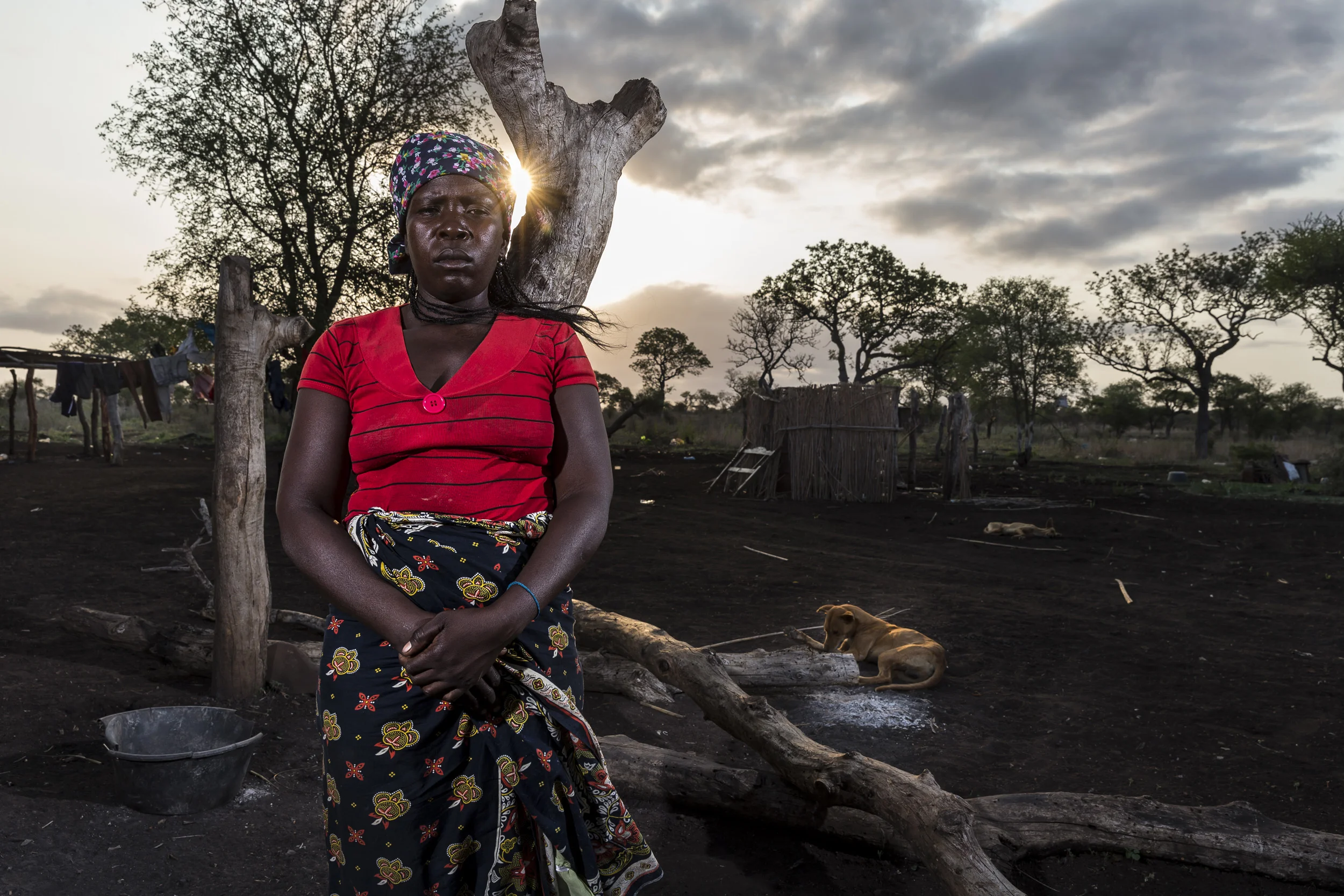 BAPTINE, MOZAMBIQUE, 1 APRIL 2016: Regina Mbiza is a widow who lost her first husband to a landmine explosion, her second husband was killed while poaching rhino in Kruger National Park in South Africa just across the border 5 kilometers from her. One of Regina's son's was arrested inside Kruger National Park for poaching rhino and her daughter also lost her husband when he was fatally wounded while poaching for Rhino in Kruger. Regina has ten children and relies on help from another of her son's who ironically works for IAPF, an anti-poaching organization. Rhino poaching is hugely influential over the whole community in this poor region of Mozambique which borders Kruger National Park. Poachers rise quickly in this community and enforce a code of silence with intimidations, beatings and killings. People are reluctant to speak about what is happening but new houses and cars in this community most often point to successful poachers and middlemen. (Photo by Brent Stirton/Getty Images Reportage for National Geographic Magazine.)
