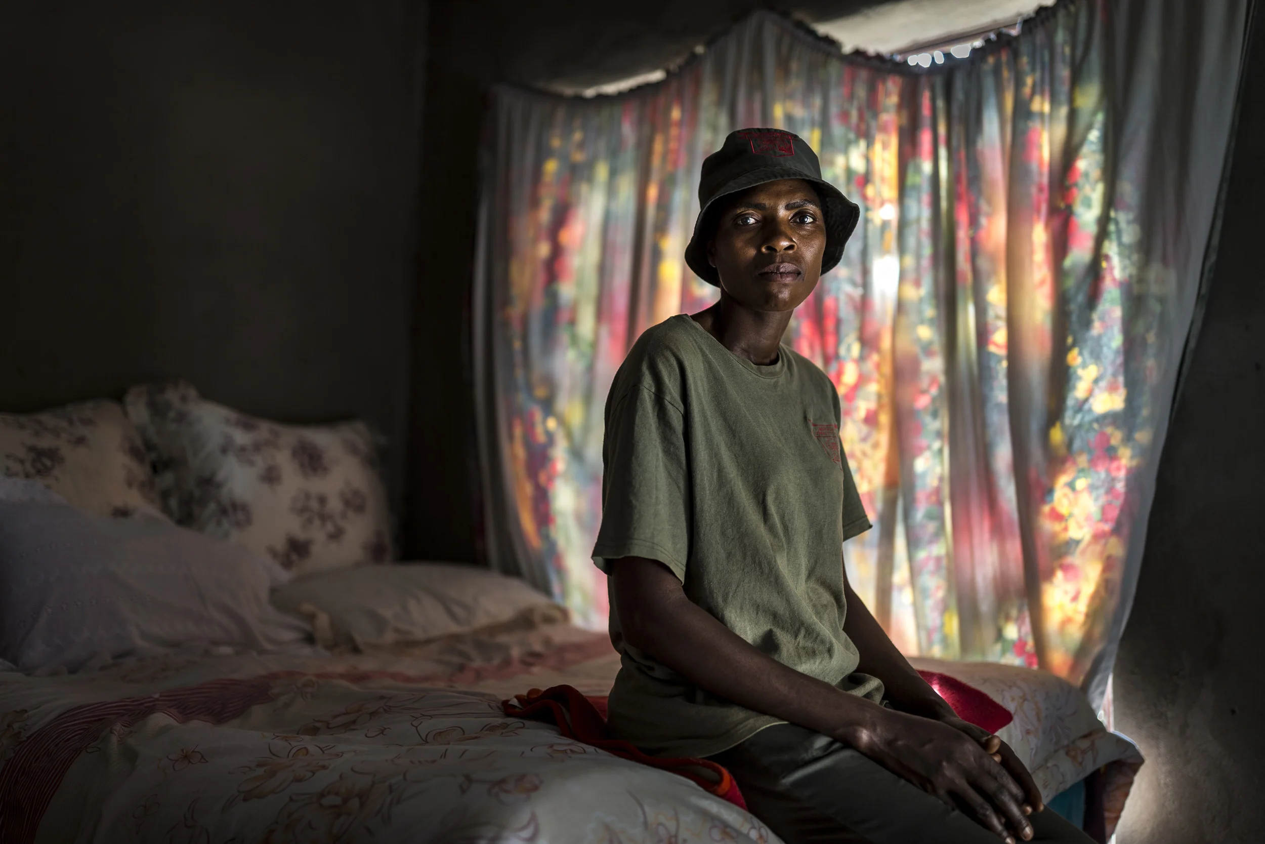 MACACASAR, MOZAMBIQUE, 5 APRIL 2016: Sabie Game park Village Police member Nomsa Nduvane, 38, seen in her modest home inside the community of Macacasar, Mozambique South Africa border. Her community is rife with rhino poachers with repeated cases coming from this poor rural community. The village has been know to shelter poachers running from the authorities. Nomsa walks more than 21 kilomteres of game fence ever few days as part of her role in the Village police, an initiative set up by the anti-poaching team at Sabie Game Park, the most active reserve on the Mozambiqe side of the border. They are the only really buffer between Kruger National Park and the many rhino poachers eager to cash in on the Rhino Horn price. Nomsa and the other village police are threatened by their community who say they are interfering in money coming into the village from poachers. Sabie Game Park borders Kruger National Park over the border in South Africa, epicenter of the poaching war for Rhino horn. (Photo by Brent Stirton/Getty Images Reportage for National Geographic Magazine.)