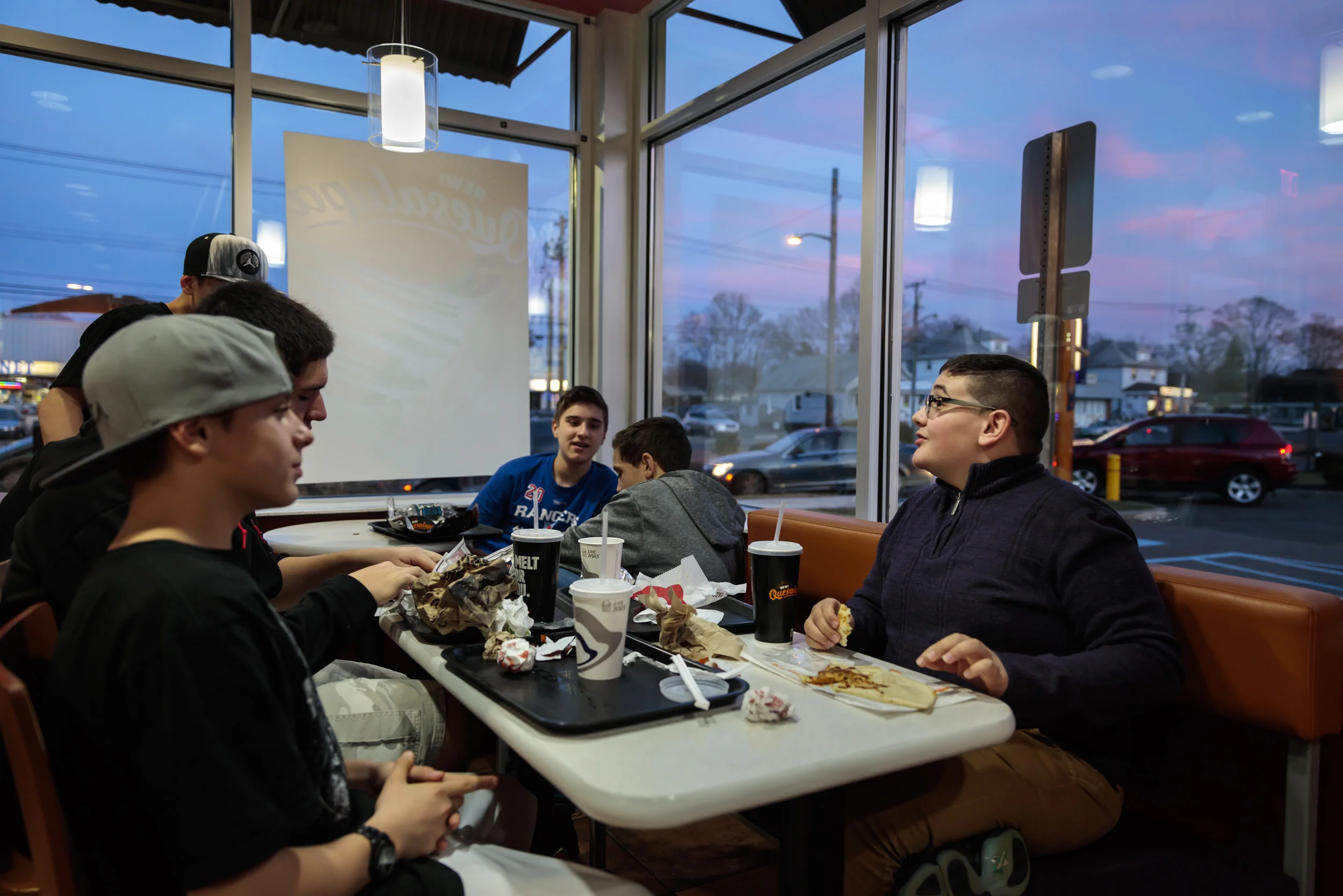 PHILADELPHIA, USA, 13TH MARCH 2016: Christian Guardino, 16, was legally blind and now sees well enough to read thanks to Gene therapy treatment that corrected his Laber’s Congenital Amaurosis syndrome. Christian began Gene Therapy at the age of 12 under Dr Jean Bennet at Children’s hospital of Philadelphia. Shortly after the therapy began he was able to identify patterns of carpets he never saw before and his night sight improved dramatically. His mother Elizabeth Guardino says that he always needed help to move around before and the use of a cane. This is no longer necessary. Christian is a singer and won the Amateur night at the famous Apollo Theatre in Harlem, NY. He is able to read his lyrics nowadays rather than relying entirely on memory. Christian remembers seeing the moon for the first time, a moment he calls pivotal. He is seen with his friends, learning lyrics in his bedroom and kitchen and at the Apollo theatre. Christian sings all the time and says that the best thing about his new sight is being able to spend time with his friends without restriction. His next wish is to be able to drive, his sight is currently around 20/50 and that may not be an impossible goal if his sight continues to improve. The Gene therapy targets a missing RP65 Gene, which was first identified in 1997. People with this issue cannot see because they lack an enzyme that breaks down Vitamin A and without that their nerve cells cannot capture light. The missing gene is delivered to the eye cells in people with inherited genetic disease and the chemical pathway is then corrected. Surgery uses a gene therapy vector virus to deliver the treatment. The surgeon places this in contact with the affected cells and injects under the retina. The cells first absorb the virus, and then the missing gene then starts to be produced by the body. Patients who have experienced this therapy say they have gone from dependence to independence; most can read and go about daily lives with ease af