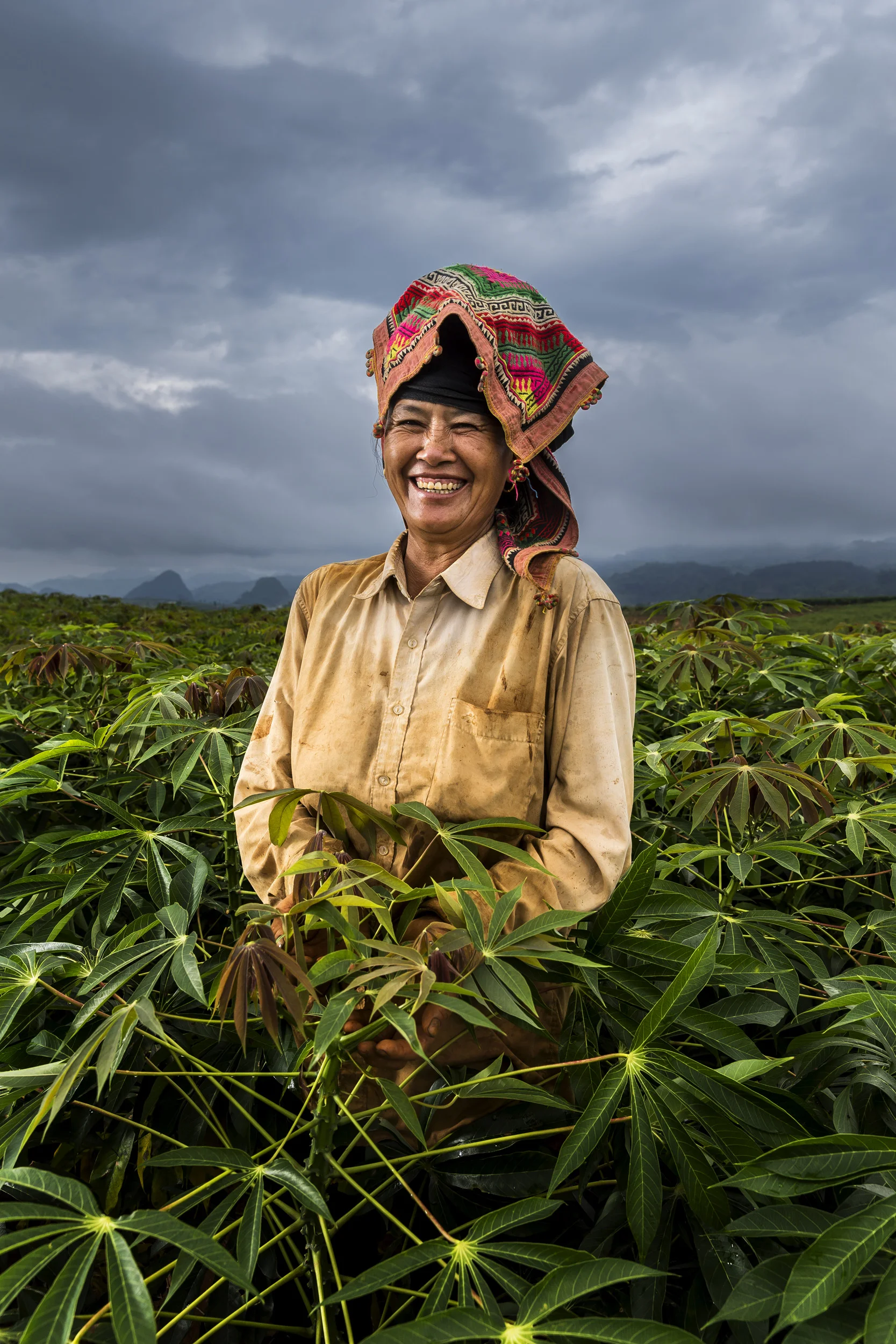 SON LA, VIETNAM, 19 AUGUST 2016: Thai minority women move amongst Cassava crops that fill the hills close to Son La city. (Photo by Brent Stirton/Reportage by Getty Images.)