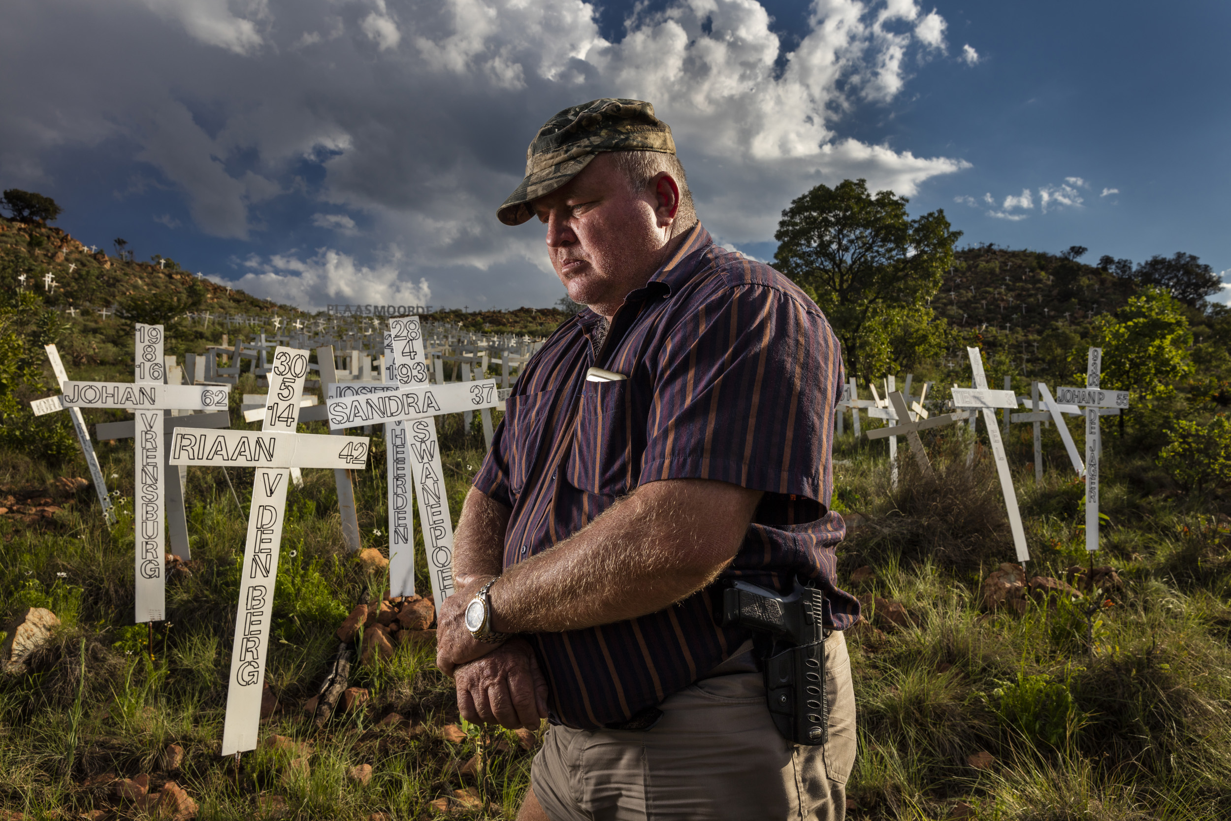 PETERSBURG, SOUTH AFRICA, 18 NOVEMBER 2016: Barend Pienaar, a self-described patriot of the Afrikaaner nation, stands amongst crosses symbolizing dead farmers killed in farm attacks litter a hillside close to the highway near Petersburg, South Afric